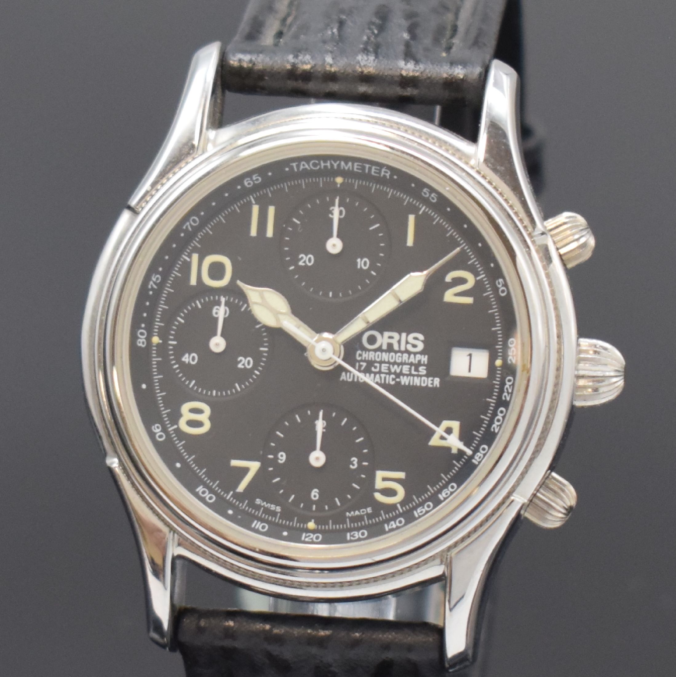 Detail a: ORIS Armbandchronograph in Stahl Referenz 7415,, Schweiz um 1995, beids. vergl. Geh., Boden verschr., orig. Lederband m. Dornschl., schwarzes ...