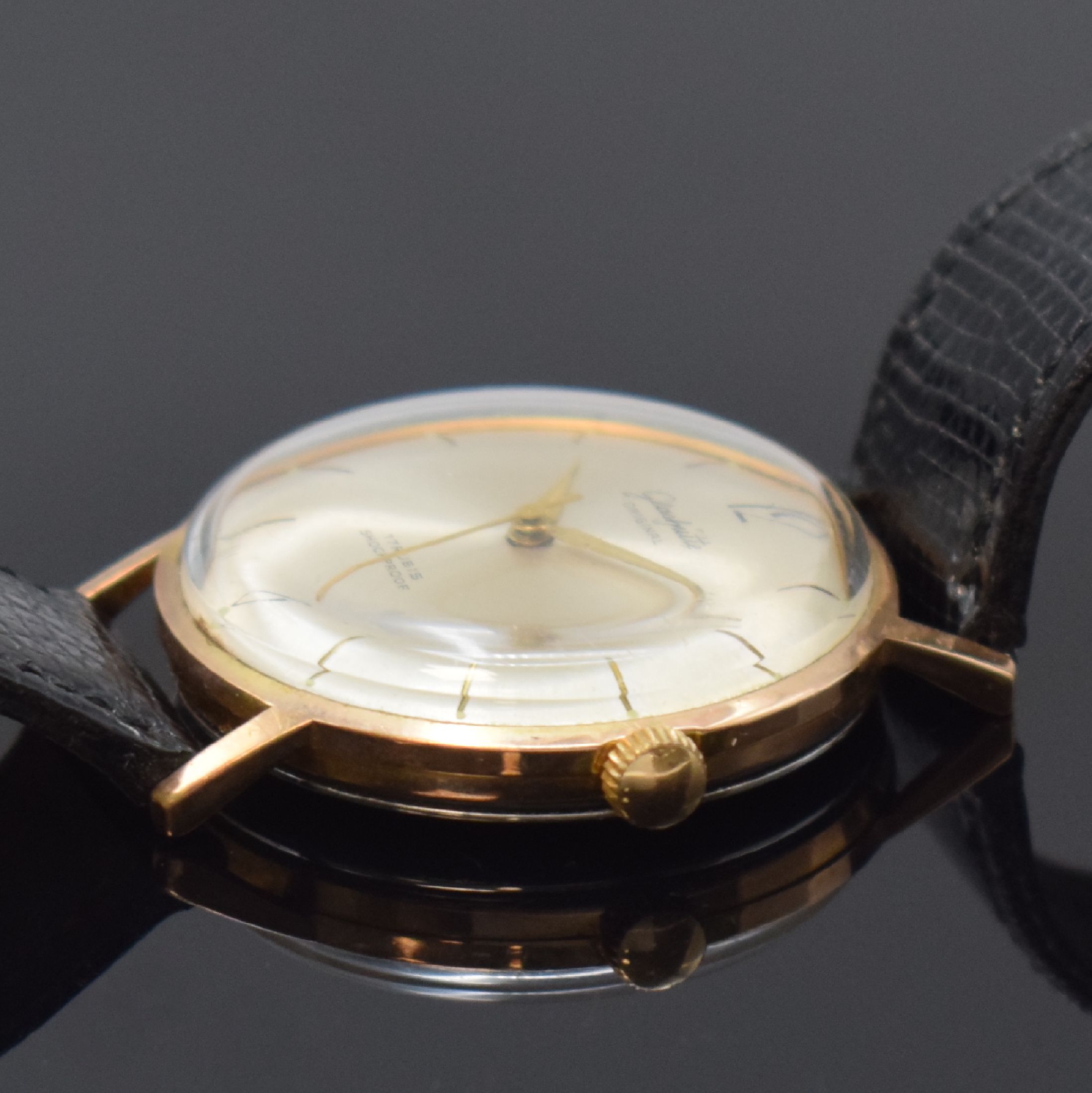 Detail b: GUB GLASHÜTTE/SA vergoldete Herrenarmbanduhr, Deutschland um 1965, Handaufzug, Edelstahlboden aufgedr., silb. Zifferbl. gold. Std.-Ind., gold. ...