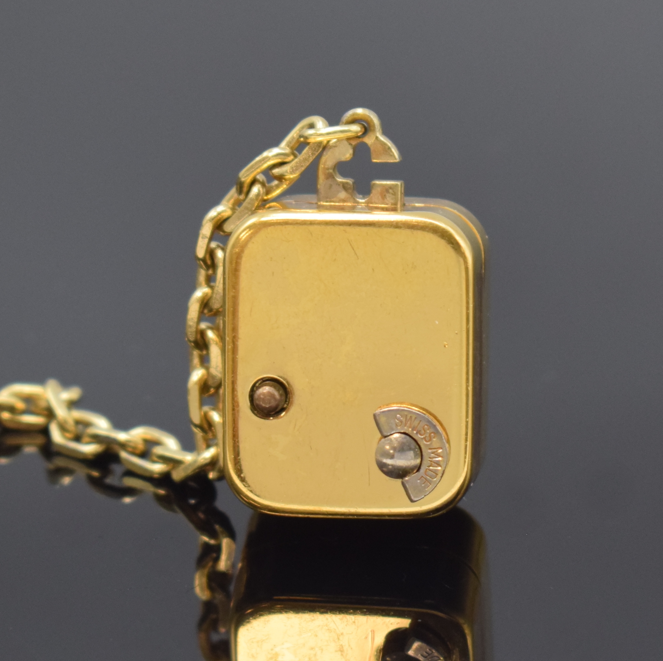 Detail a: REUGE Miniatur-Uhr mit Spielwerk, Schweiz um 1980, Quarz-Uhrwerk, verg. Geh., silb. Zifferbl. m. gold. Zeiger, Anz. v. Std. u. Min., Walzenspielwerk, ...