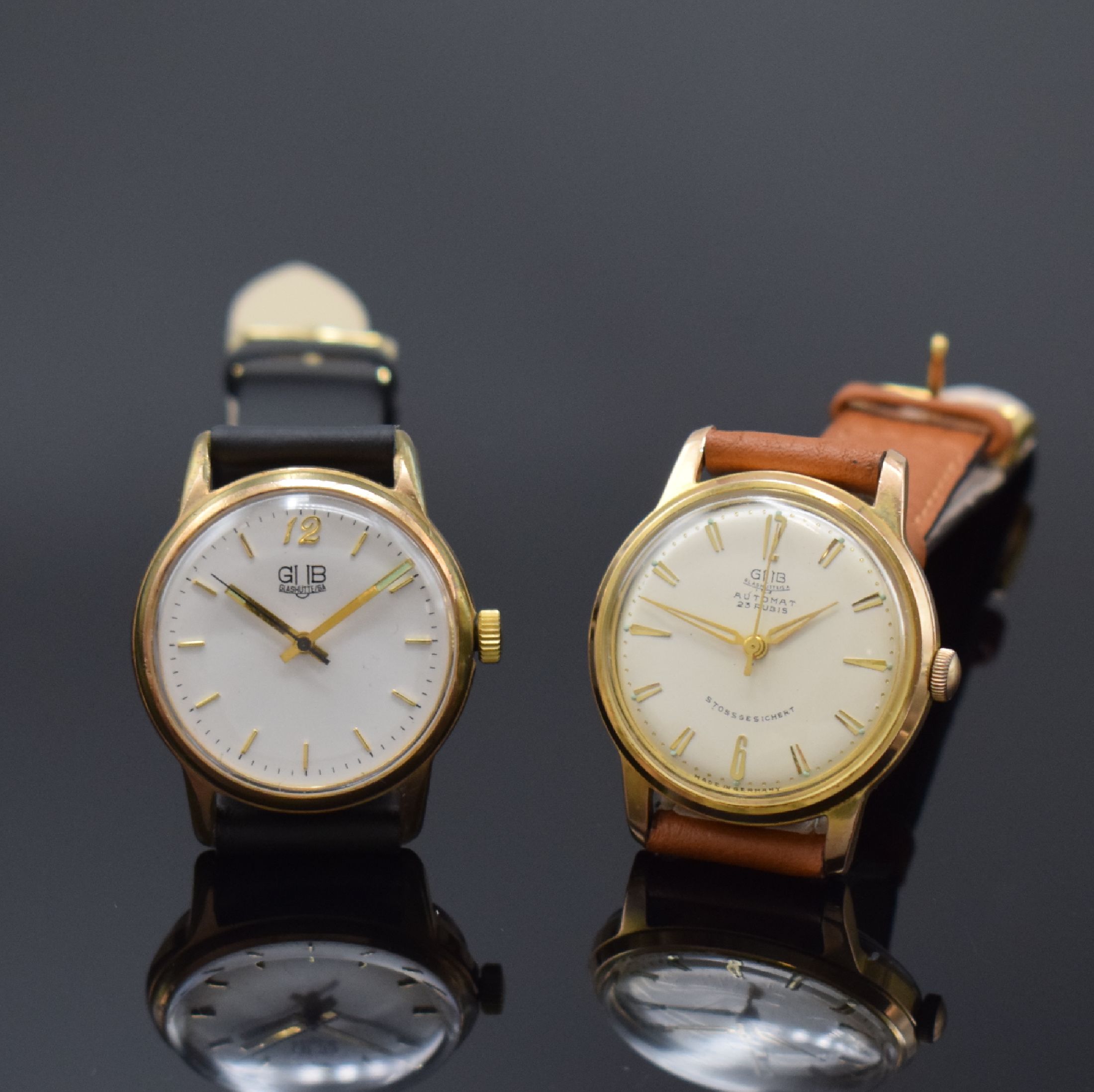 GUB 2 vergoldete Armbanduhren, Deutschland um 1960, 1) GUB Kaliber 68.1, Automatik, verg. Geh., aufgedr. Stahlboden, silb. Zifferbl., gold. Indizes ...