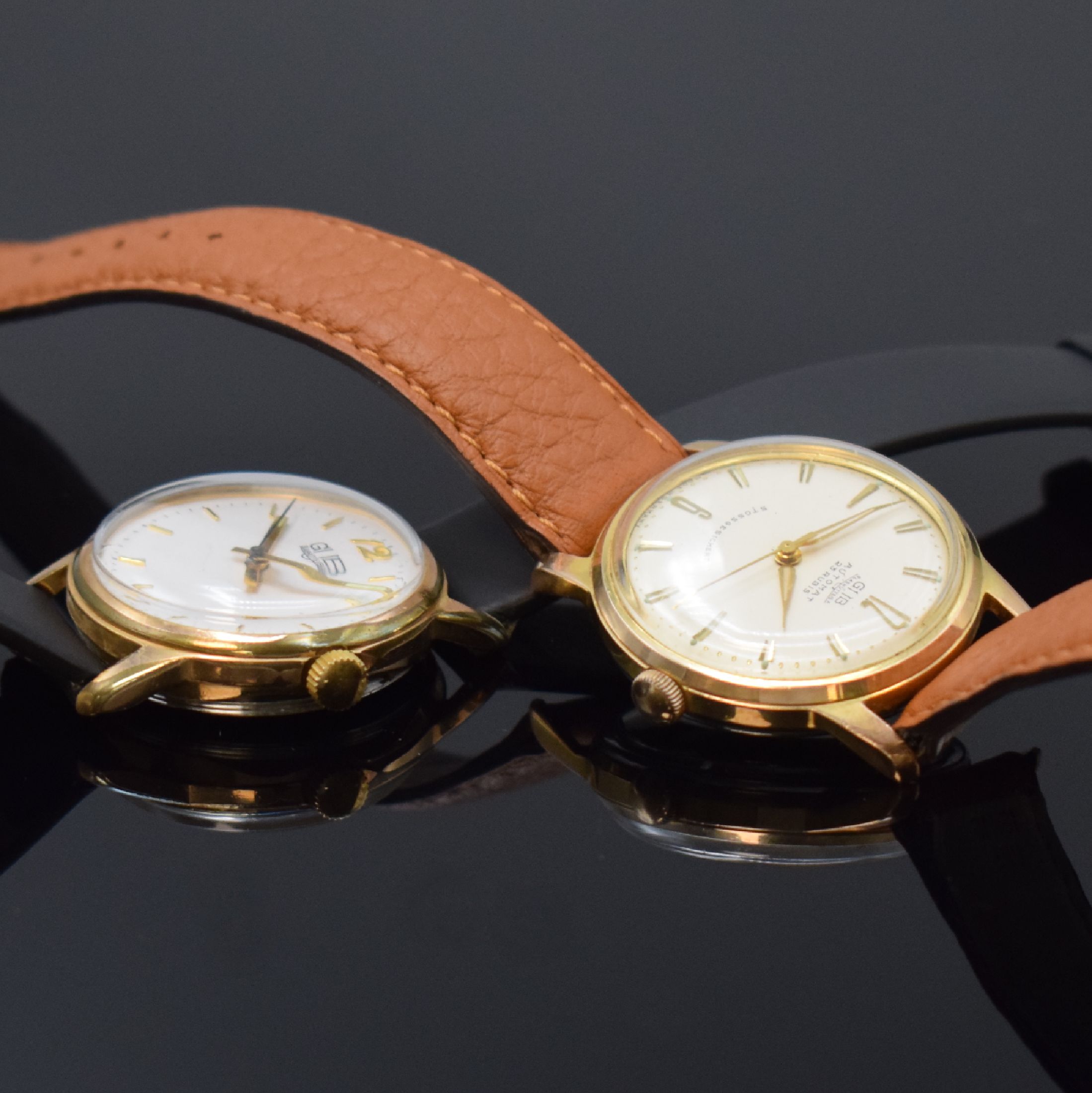 Detail c: GUB 2 vergoldete Armbanduhren, Deutschland um 1960, 1) GUB Kaliber 68.1, Automatik, verg. Geh., aufgedr. Stahlboden, silb. Zifferbl., gold. Indizes ...