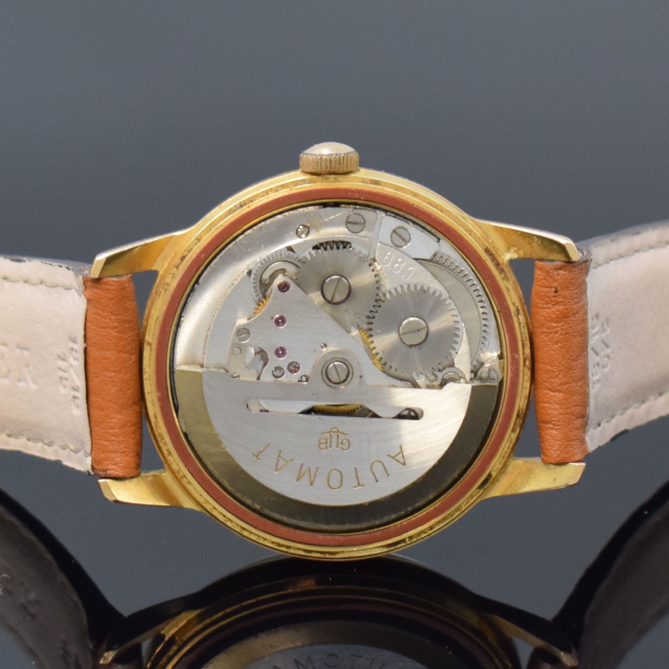 Detail h: GUB 2 vergoldete Armbanduhren, Deutschland um 1960, 1) GUB Kaliber 68.1, Automatik, verg. Geh., aufgedr. Stahlboden, silb. Zifferbl., gold. Indizes ...