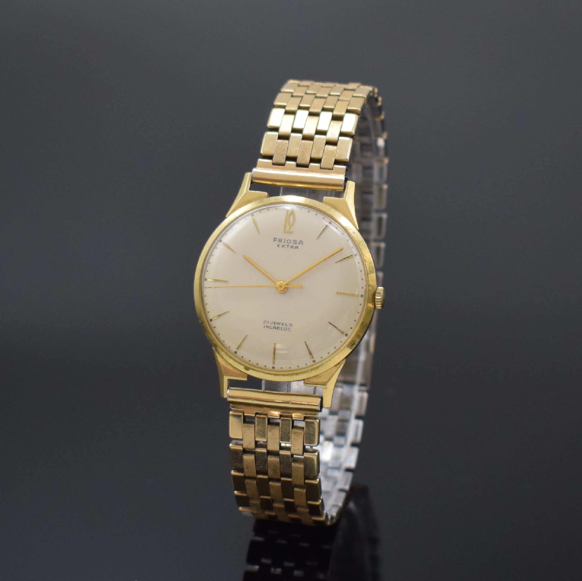 PRIOSA Extra Armbanduhr in GG 585/000, Schweiz um 1960, Handaufzug, Boden aufgedr., verg. Flexband, silb. Zifferbl. m. gold. Std.-Ind., gold. Zeiger, ...