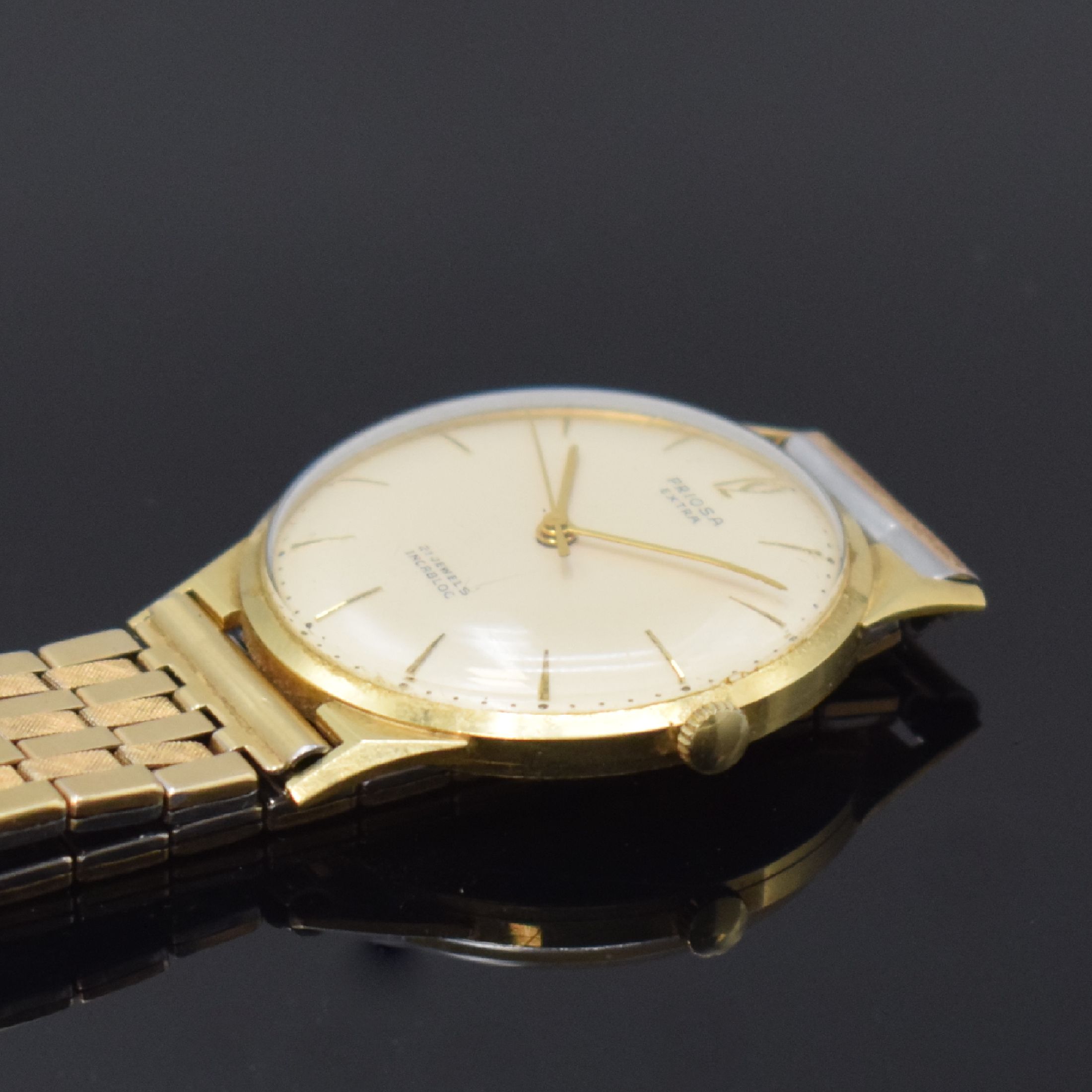 Detail b: PRIOSA Extra Armbanduhr in GG 585/000, Schweiz um 1960, Handaufzug, Boden aufgedr., verg. Flexband, silb. Zifferbl. m. gold. Std.-Ind., gold. Zeiger, ...