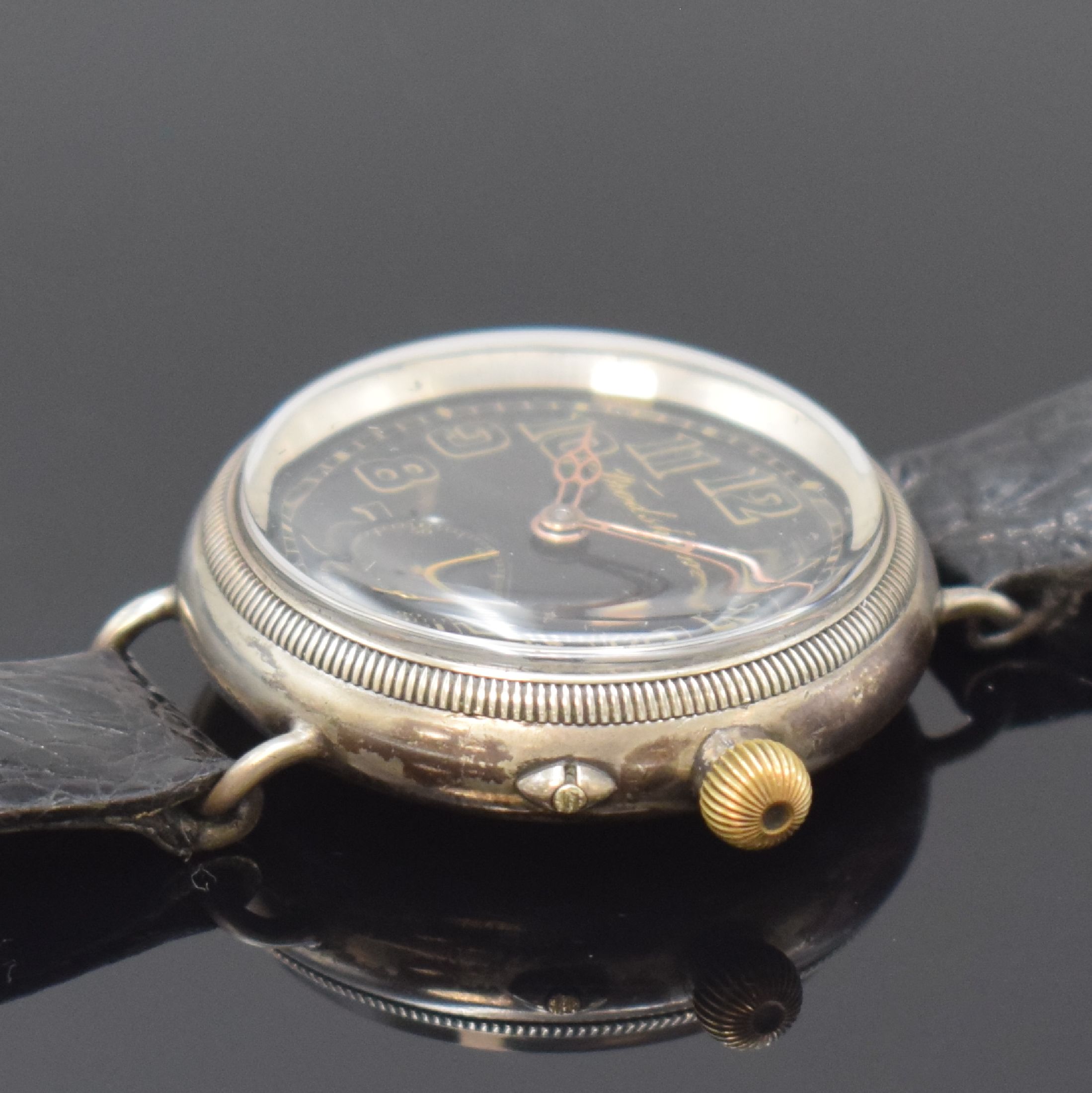 Detail c: IWC / Frodsham / Stauffer & Co. frühe Herrenarmbanduhr, Handaufzug, Schweiz um 1916, verschr. Sterlingsilbergeh. von F. Borgel, schwarzes Zifferbl. ...