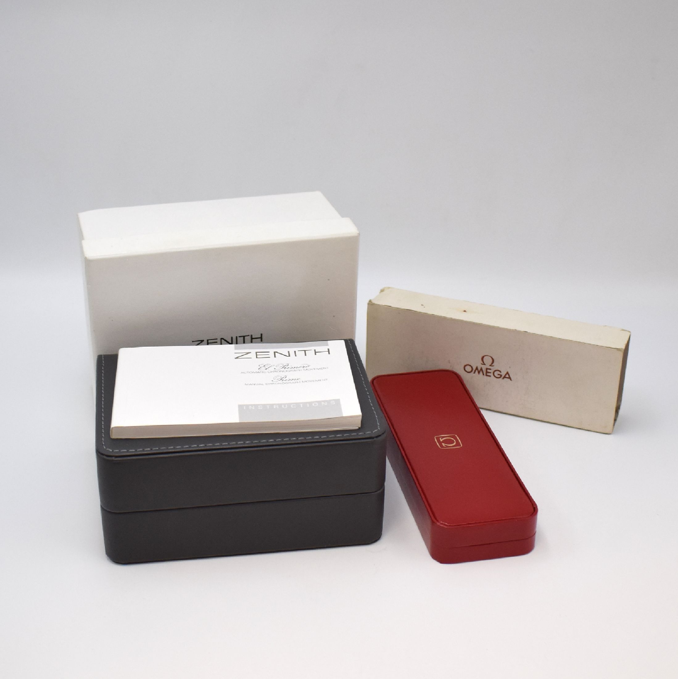 Set bestehend aus ZENITH Etui mit Bedienungsanleitung/unausgef. Garantiekarte und OMEGA Box, jeweils mit Überkarton, voll nutzbar, aus ...