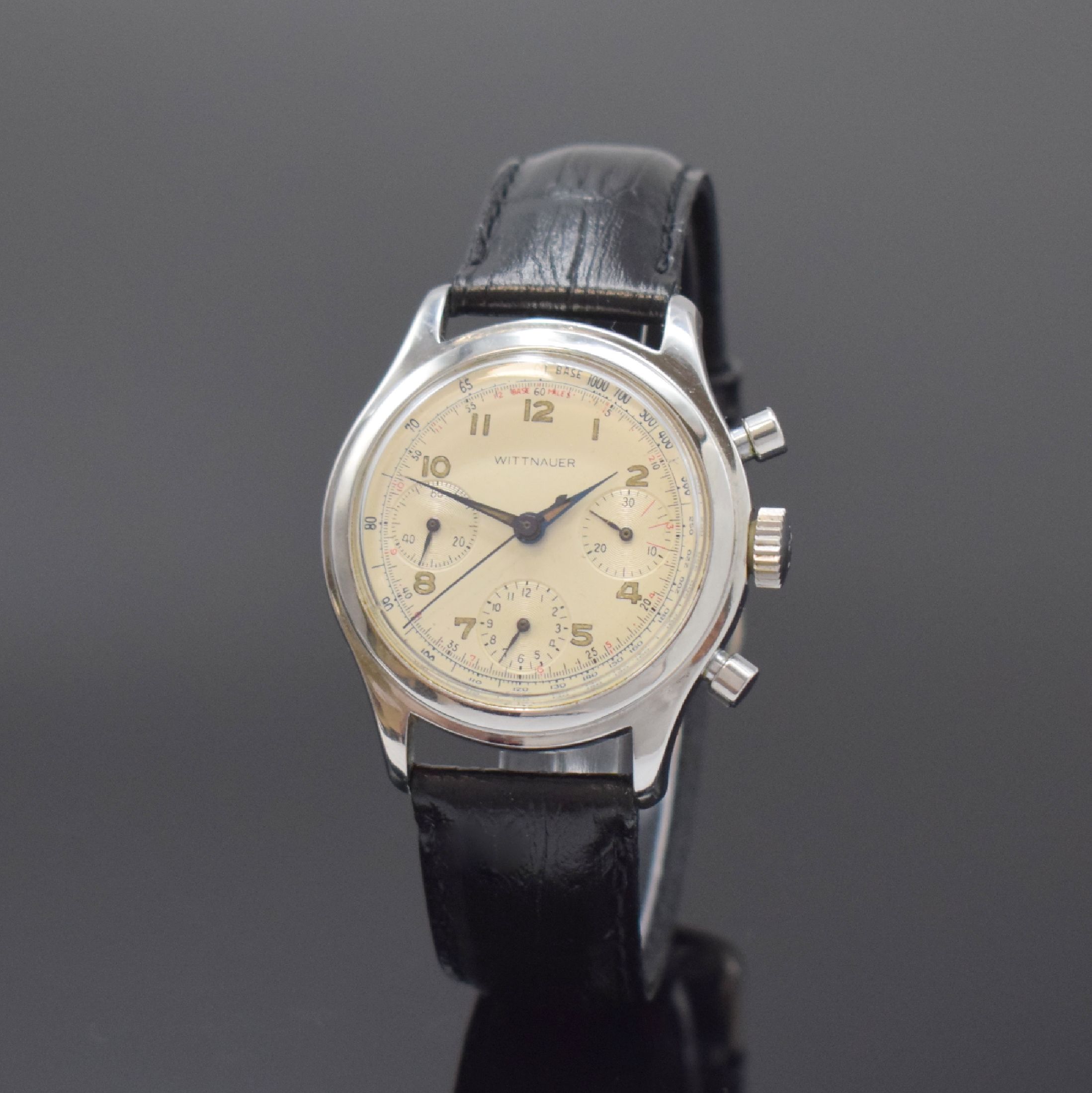 WITTNAUER Schaltradchronograph in Stahl, Schweiz um 1960, Handaufzug, verschr. Boden, silb. Zifferbl. m. arab. Leuchtzahlen, gebl. Leuchtzeiger, 12 ...