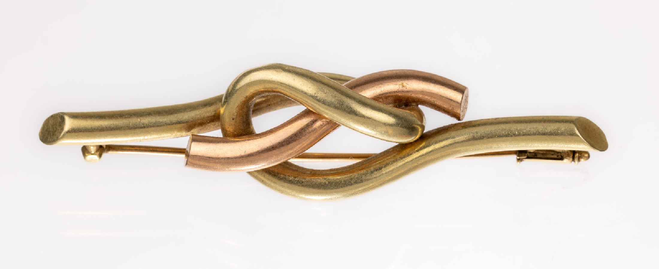 14 kt Gold Brosche, GG/RG 585/000 gefüllt, ineinander verschlungen, ca. 6.9 x 1.5 cm, ca.10.3 g