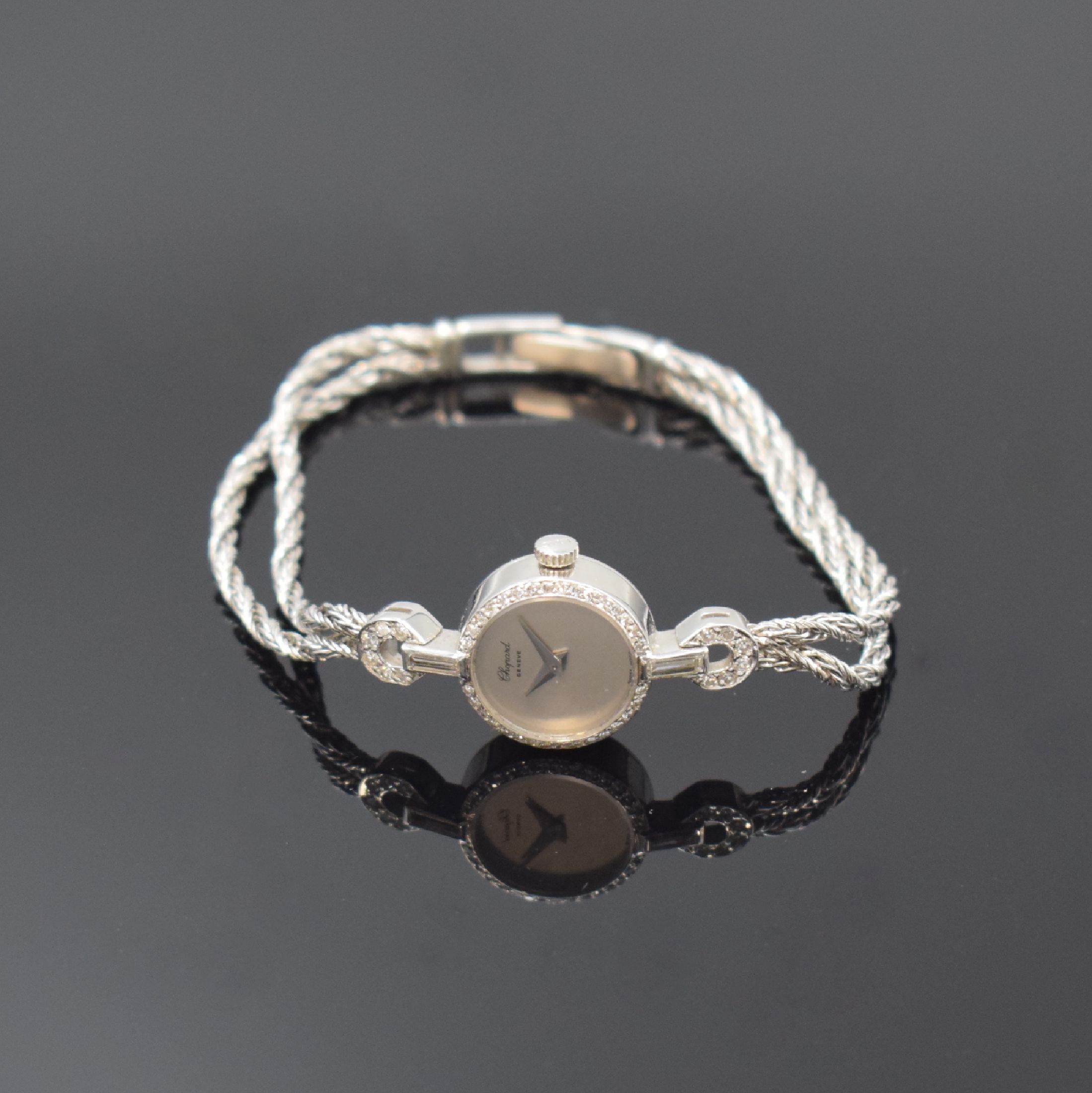 CHOPARD Damenschmuckbanduhr in WG 750/000, Schweiz um 1975, Handaufzug, Lünette wie Bandansätze aufw. m. Diamanten bes., Boden aufgedr., verg. ...
