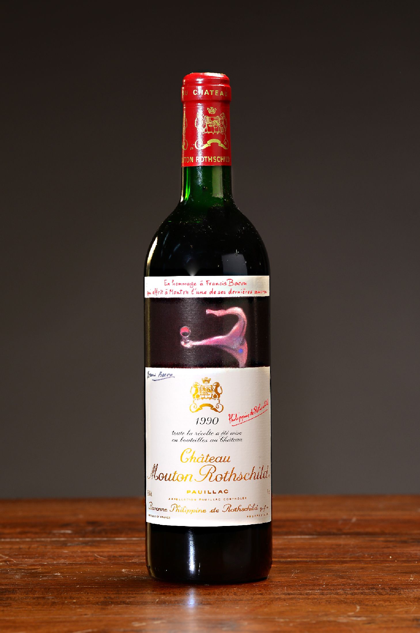 1 Flasche 1990 Chateau Mouton Rothschild, Pauillac, ca. 75cl, 12,5% Vol., Mid shoulder, Etikett illustriert von Francis Bacon, Kapsel l. best., 90 ...