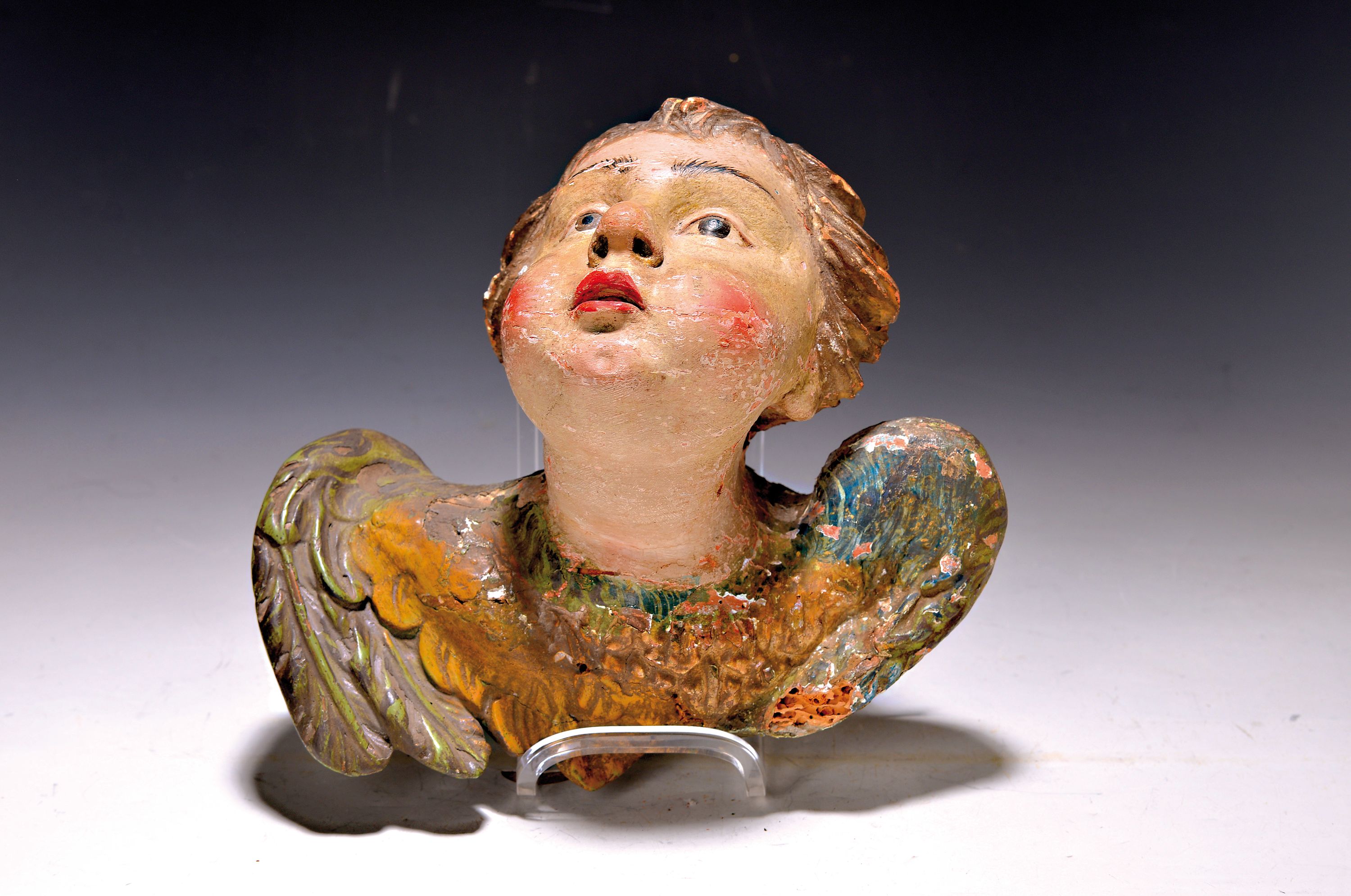 Puttenkopf, süddeutsch, 2. Hälfte 18. Jh., Lindenholz geschnitzt und polychrom gefaßt, altersbedingt leicht besch., H. ca. 22cm