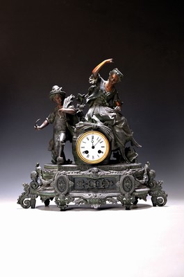 Image 26725048 - Pendulum, France around 1900, tin zinc alloy, bronze-colored patinated, dancing and music- making harvest couple, some figures loosened, glass lid in front and behind (edges damaged) Enamel dial, pendulum movement according to: Japy, half hour. Impact does not trigger, pendulum sec., overhaul essential, height approx. 45cm, condition of movement 3-4, housing 3