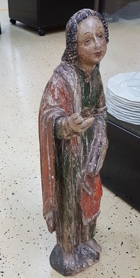 26725070b - Saint sculpture, southern German, 2nd half of the 18th century, carved wood, standing representation with book and gesture of instruction, remains of old version in green and red, curly hair, signs of age, 2 fingers missing, one present, height approx. 74cm