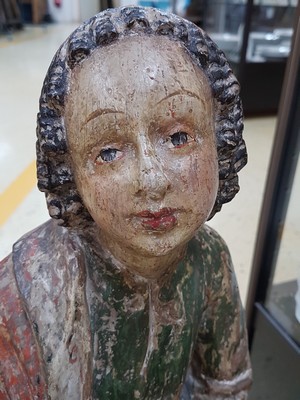 26725070d - Saint sculpture, southern German, 2nd half of the 18th century, carved wood, standing representation with book and gesture of instruction, remains of old version in green and red, curly hair, signs of age, 2 fingers missing, one present, height approx. 74cm