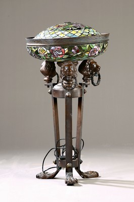 Image 26725114 - Table or floor lamp in the Tiffany style, heavy bronze base with paw feet and three ringed lion heads, bowl and slightly smaller dome in colorful leaded glass with floral decoration, electrical not tested, height approx. 87cm
