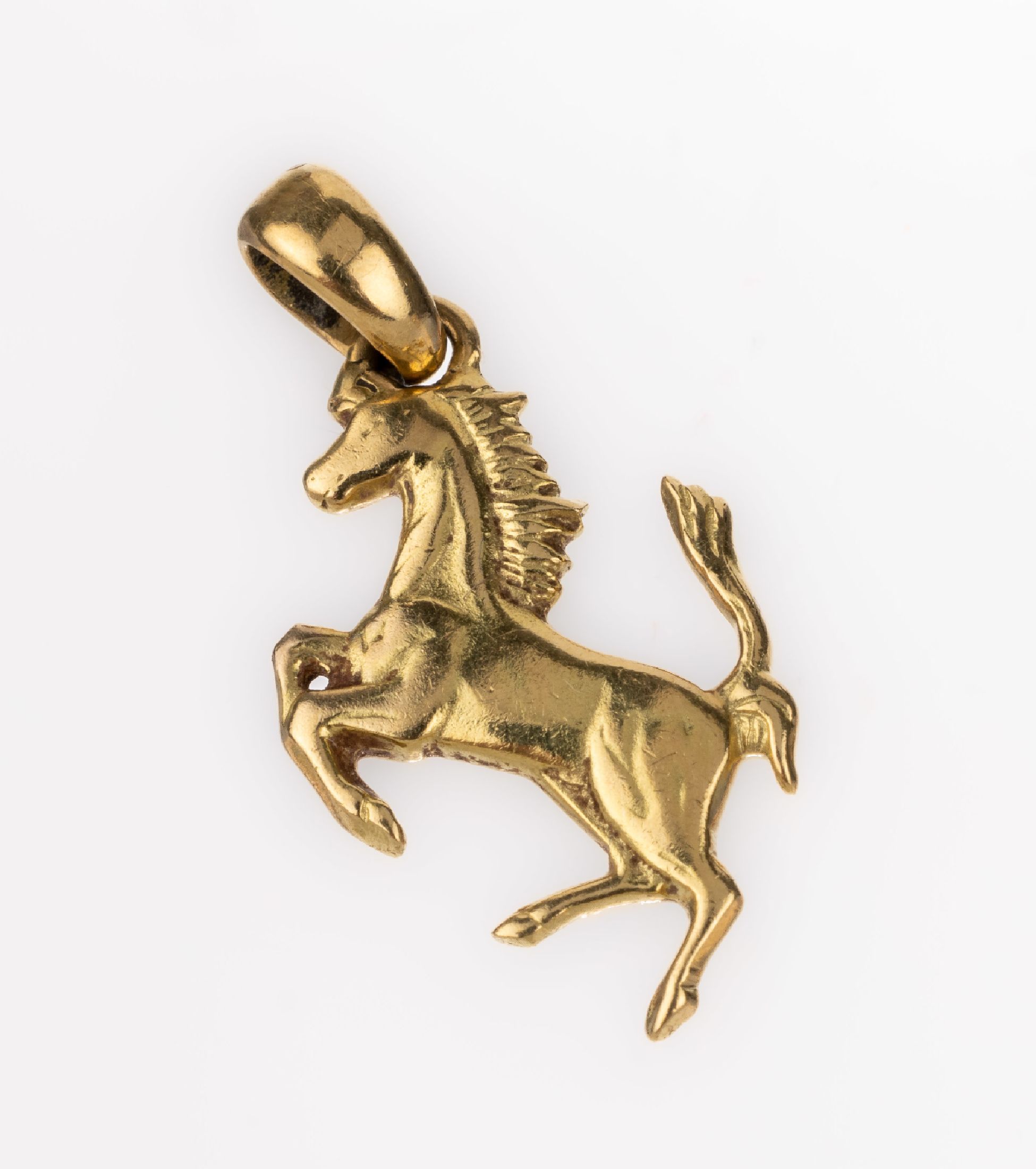 18 kt Gold Anhänger, GG 750/000, galoppierendes Pferd, ca. 1.6 g, L. ca. 2 cm