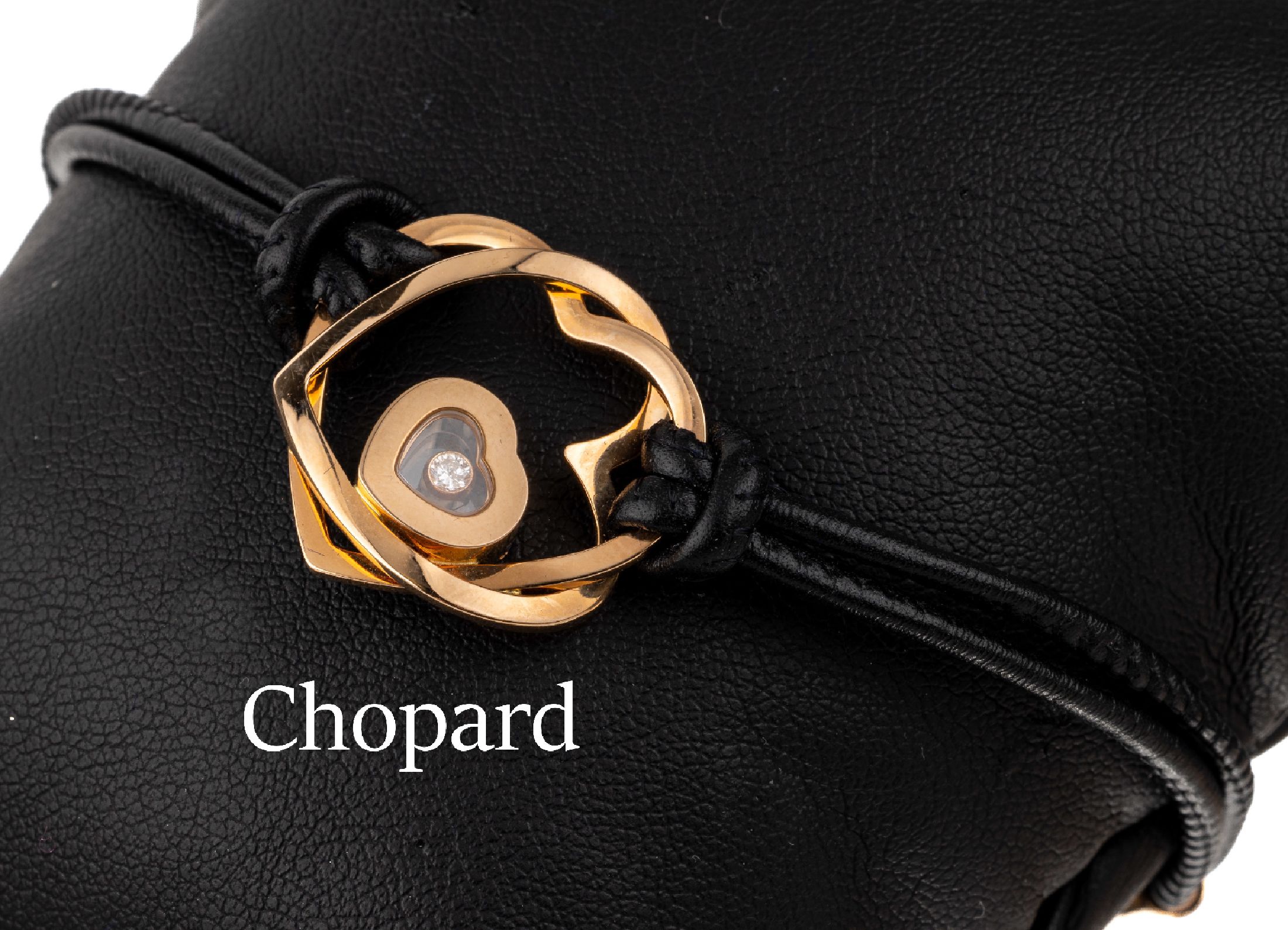18 kt Gold und Leder CHOPARD Brillant- Armband, RoseG 750/000, Monturen und Mittelteil 18 kt Gold, 2-reihiger Lederriemen,1 beweglicher Brillant in ...
