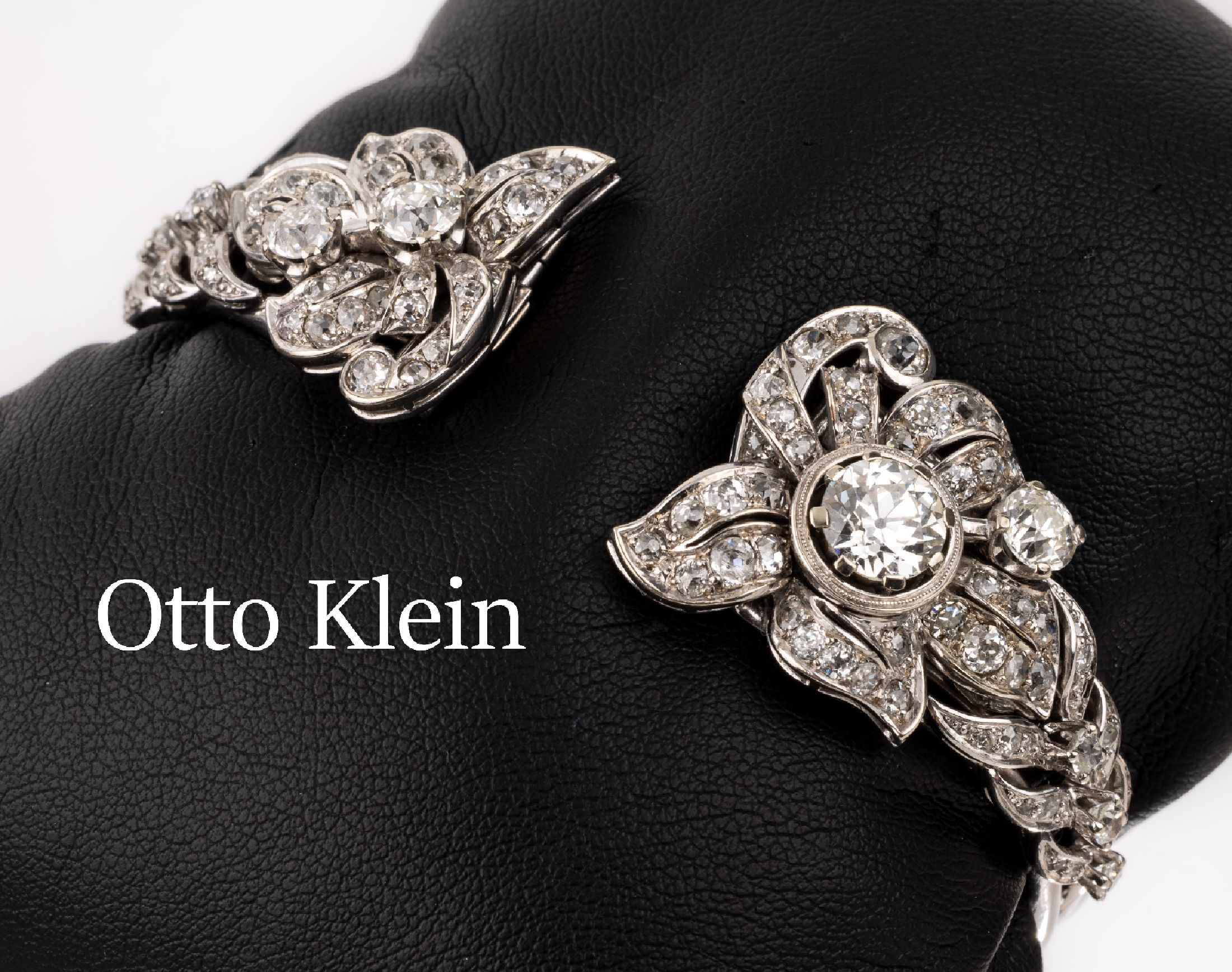 OTTO KLEIN 14 kt Gold Diamant-Armreif, WG 585/000, Verzierungen abnehmbar und jeweils als Clips tragbar, asymm. Aufbau, 1 Altschliff-Diamant ca. ...