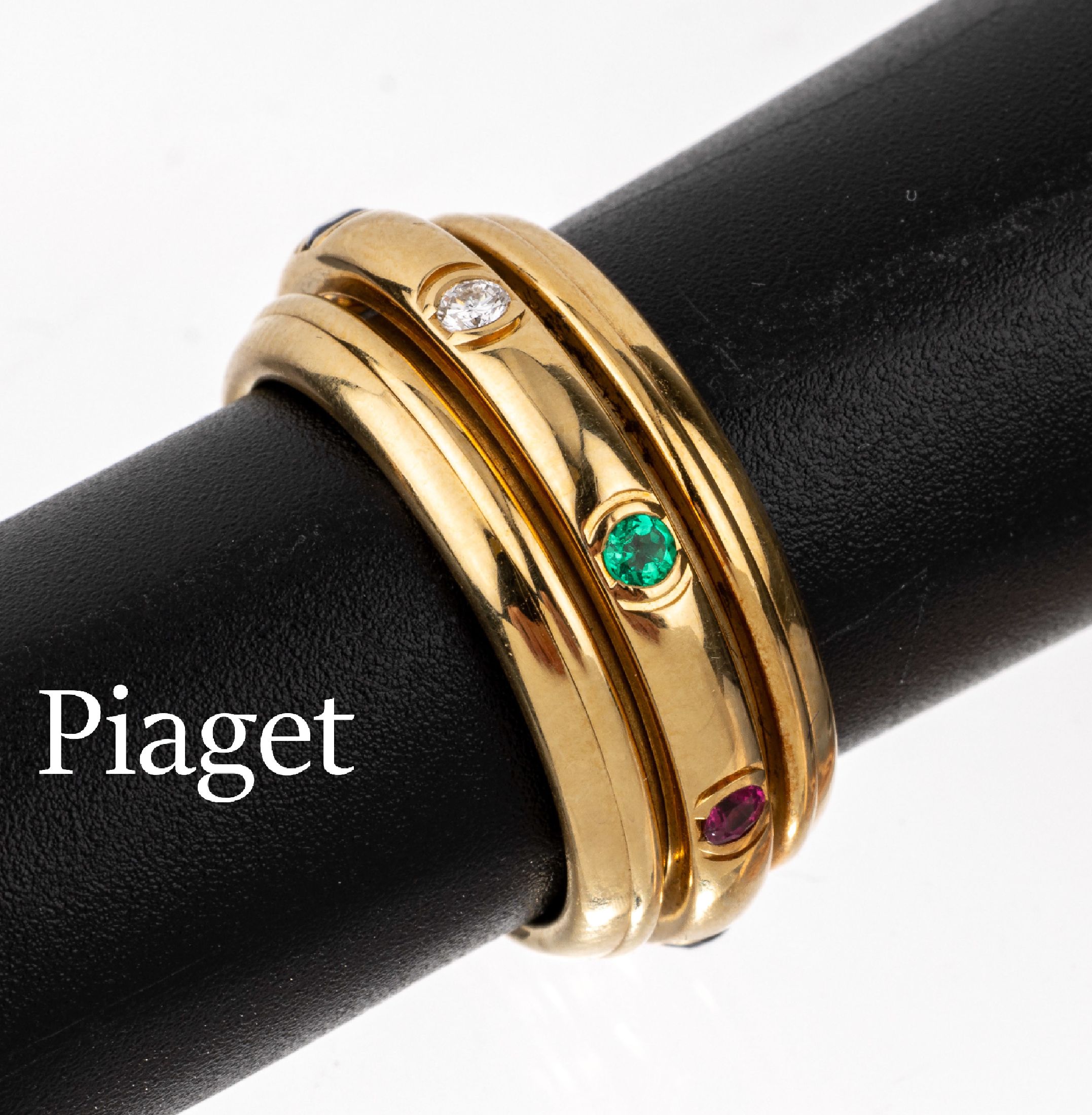 18 kt Gold PIAGET Brillant-Farbstein-Ring, GG 750/000, Ringschiene drehbar, 2 Brillanten zus. ca. 0.08 ct Weiß/vs, 6 rundfacett. Saphire, Rubine ...