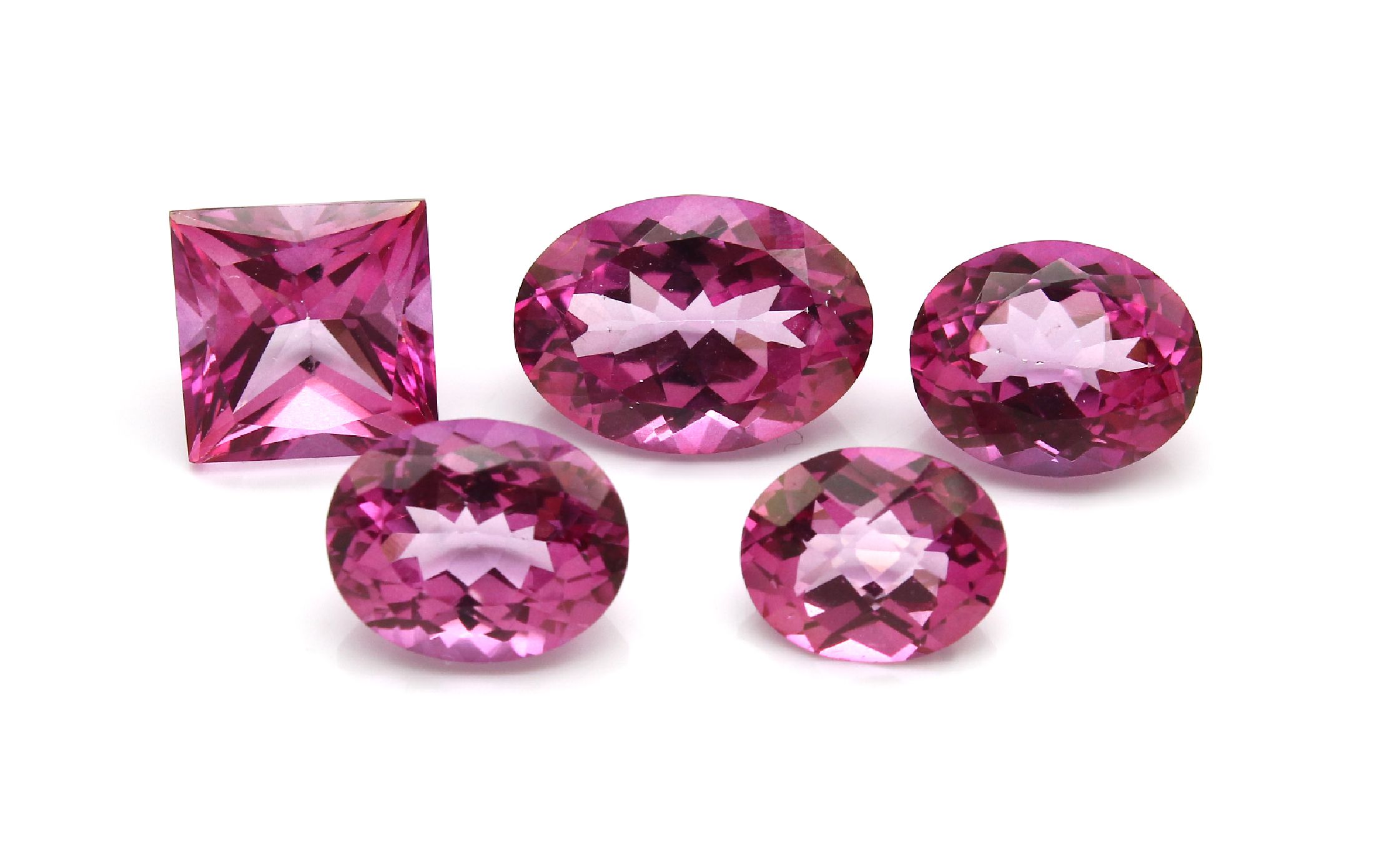 Lot 5 lose pinkfarb. Topase (beh.), ca. 24.31 ct, versch. Schliffformen und Größen