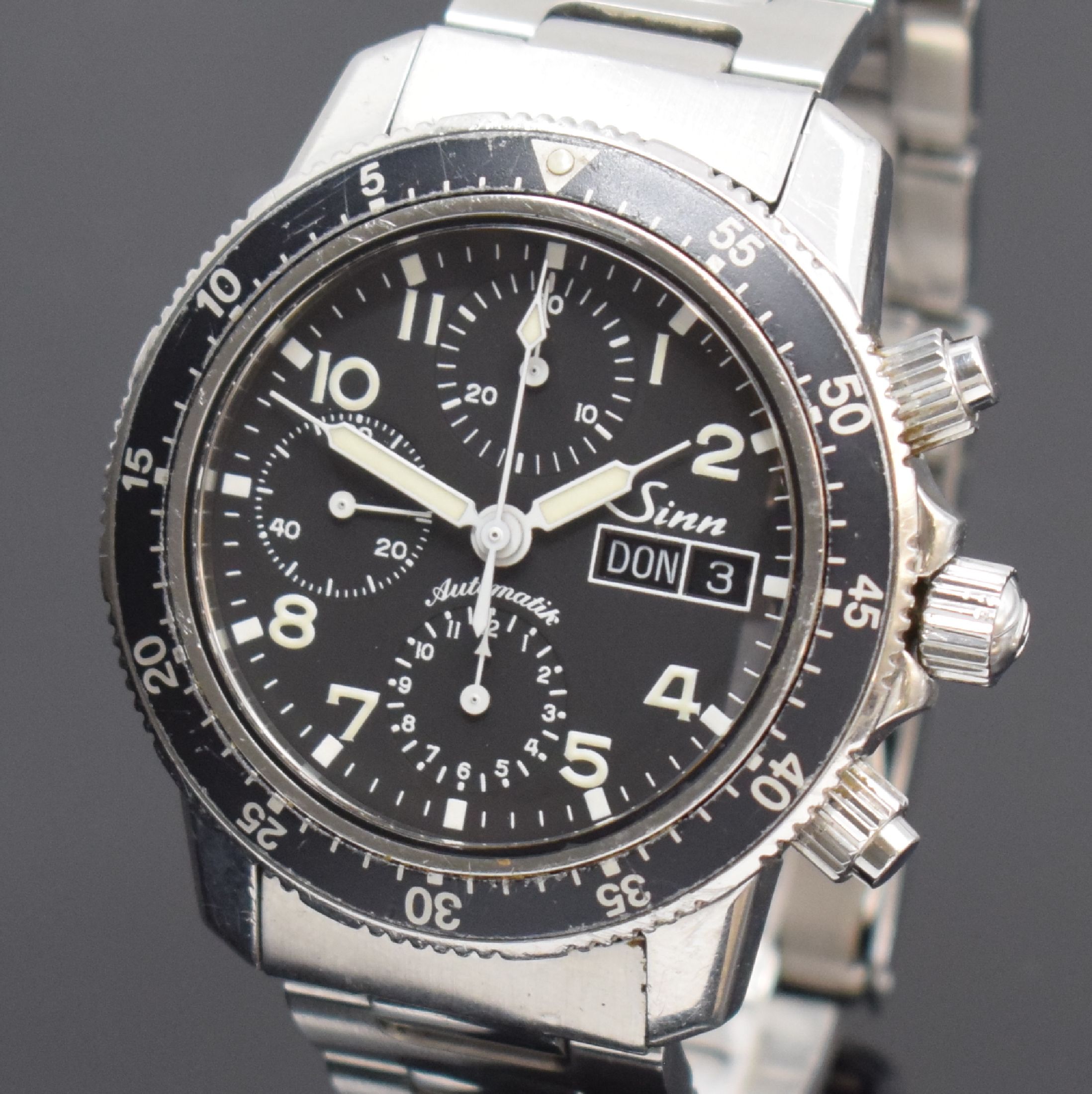 Detail a: SINN Herrenarmbanduhr mit Chronograph Referenz 103, Automatik, Deutschland um 2003, verschr. Edelstahlgeh. inkl. orig. Gliederband m. Faltschl., ...