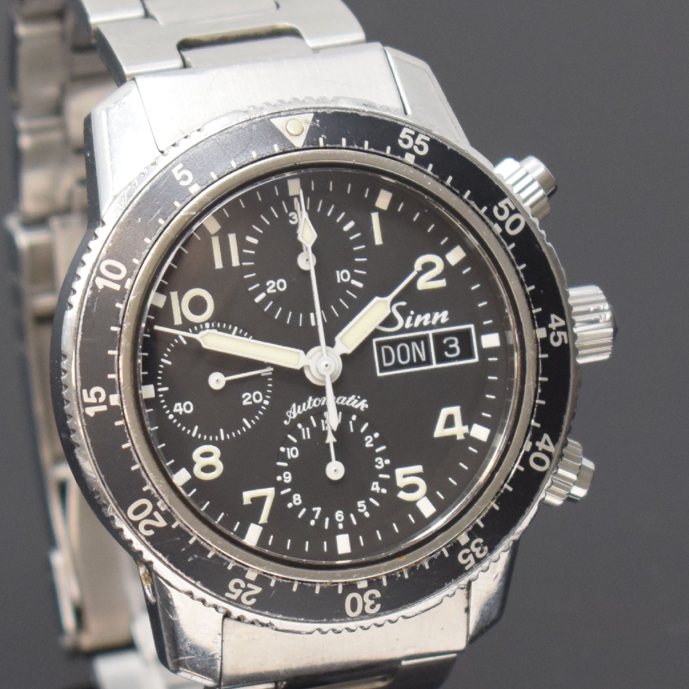 Detail c: SINN Herrenarmbanduhr mit Chronograph Referenz 103, Automatik, Deutschland um 2003, verschr. Edelstahlgeh. inkl. orig. Gliederband m. Faltschl., ...
