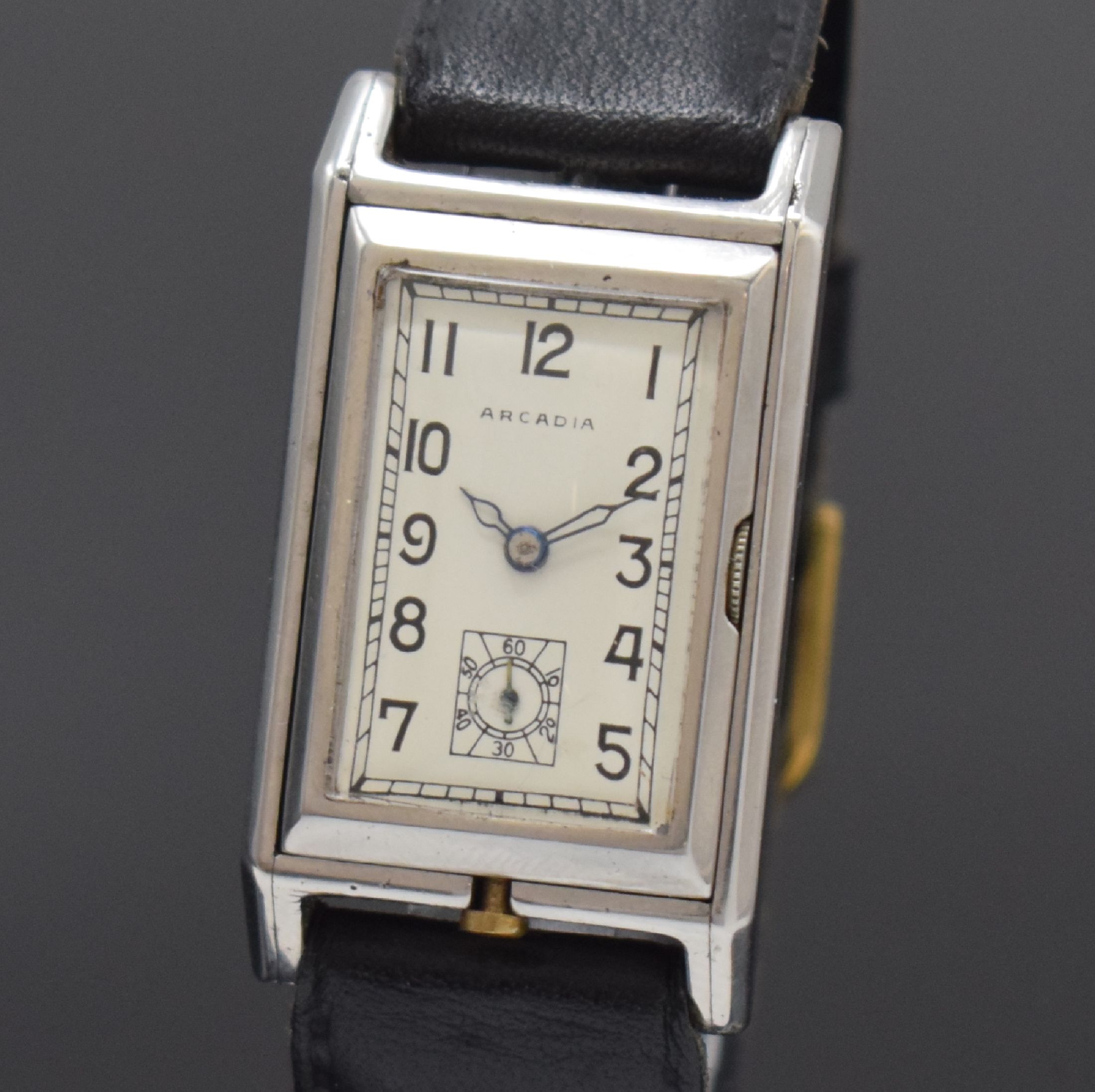 Detail a: ARCADIA seltene frühe Wende-Armbanduhr in Stahl, Schweiz um 1940, Handaufzug, rechteck. Geh., im Innenteil in der 12/6-Achse um 180 Grad zu drehen, ...