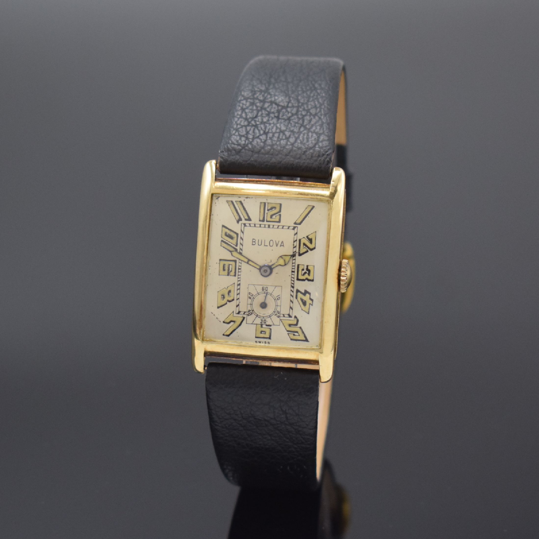 BULOVA frühe rechteckige Armbanduhr in GG 585/000, Schweiz um 1925, Handaufzug, Scharniergeh. (Stift zu ers.), Boden dell., silb. Zifferbl. m. ...