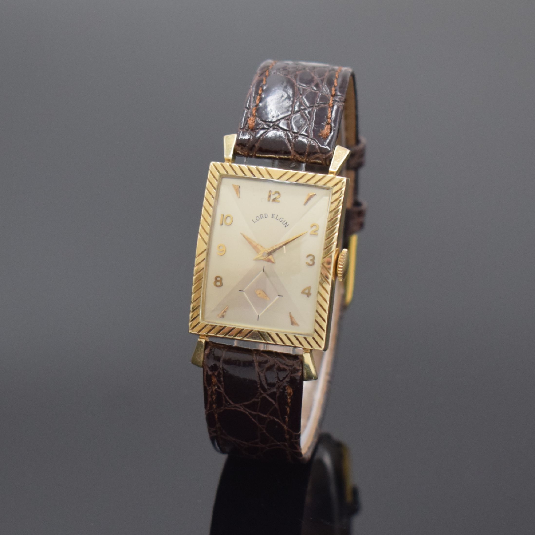 LORD ELGIN Armbanduhr in 14k Gelbgold, USA um 1955, Handaufzug, 2-tlg. Geh., Boden aufgedr., silb., diagonal gespiegeltes Zifferbl., aufges. gold. ...