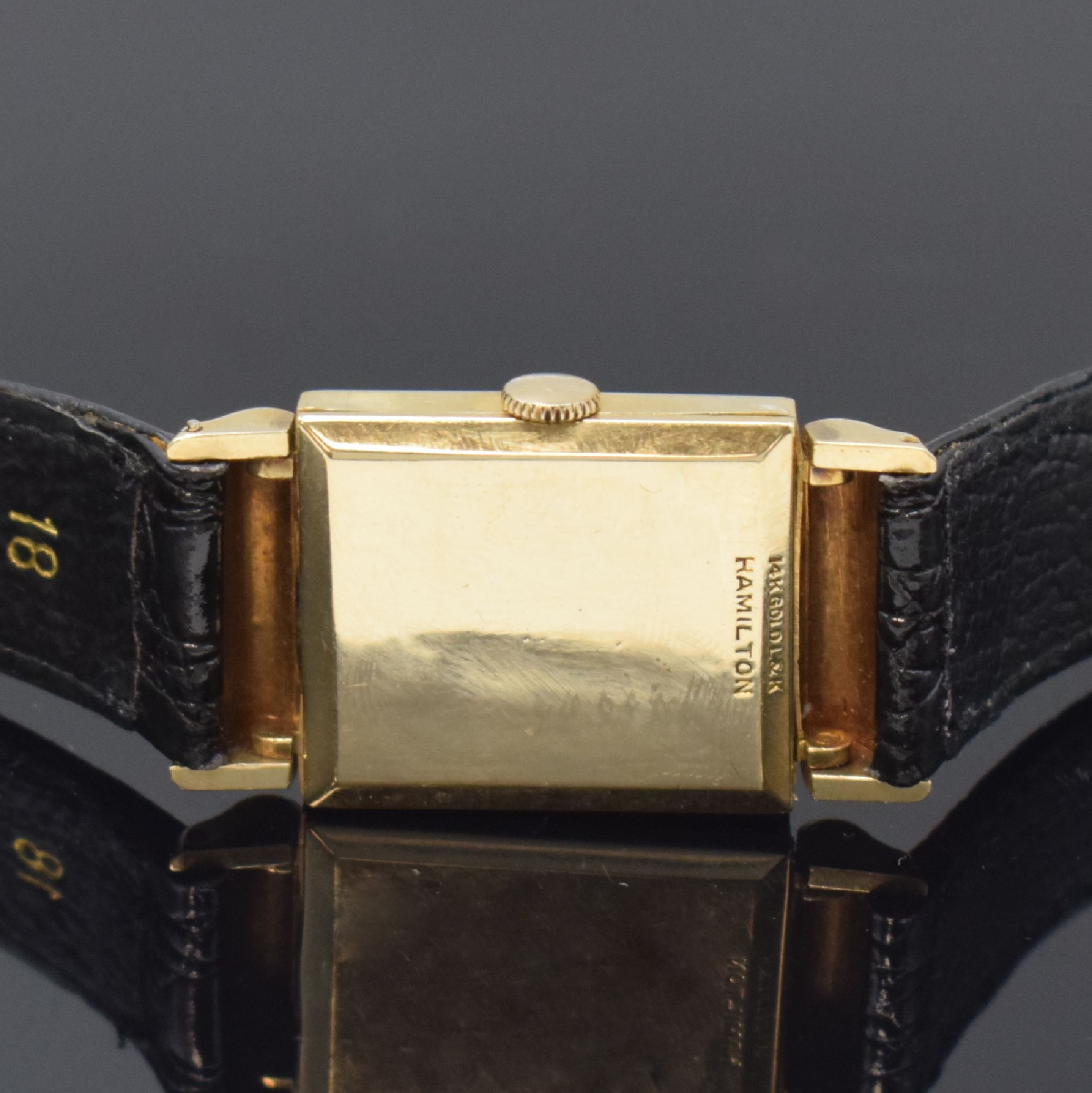 Detail c: HAMILTON rechteckige Armbanduhr in 14k Gelbgold, USA um 1950, Handaufzug, 2-tlg. Geh. m. aufgedr. Boden dell., silb. Duoton- Zifferbl. rest., aufges. ...