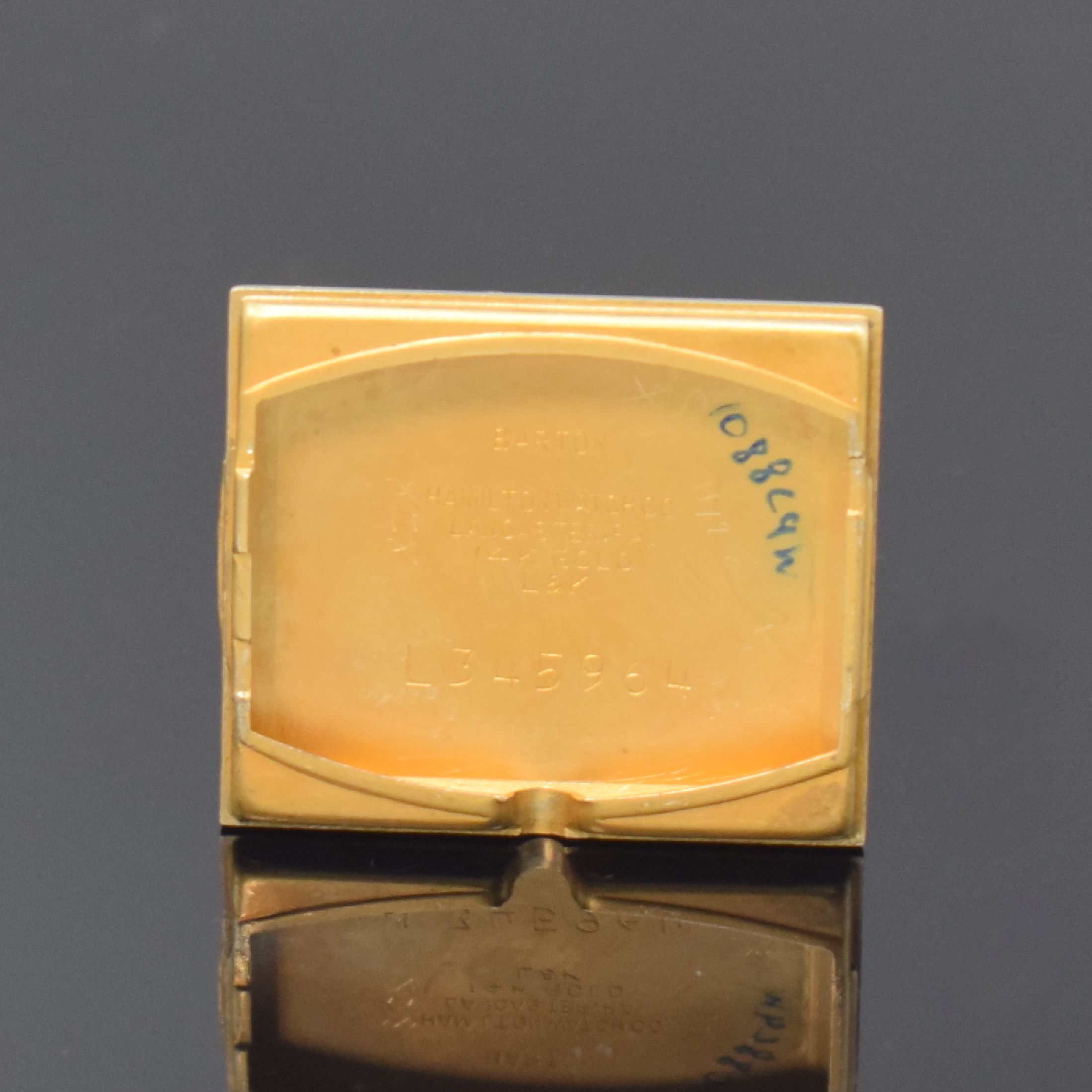 Detail e: HAMILTON rechteckige Armbanduhr in 14k Gelbgold, USA um 1950, Handaufzug, 2-tlg. Geh. m. aufgedr. Boden dell., silb. Duoton- Zifferbl. rest., aufges. ...