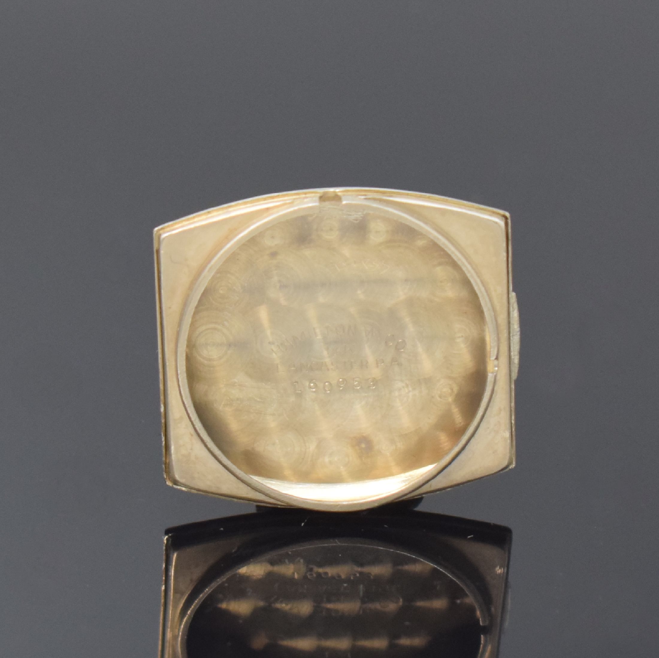 Detail e: HAMILTON Armbanduhr in WG 585/000, USA um 1940, Handaufzug, 2-tlg. Tonneau-Geh., Boden aufgedr., silb. Zifferbl., aufges. gold. Breguetzahlen, gold. ...