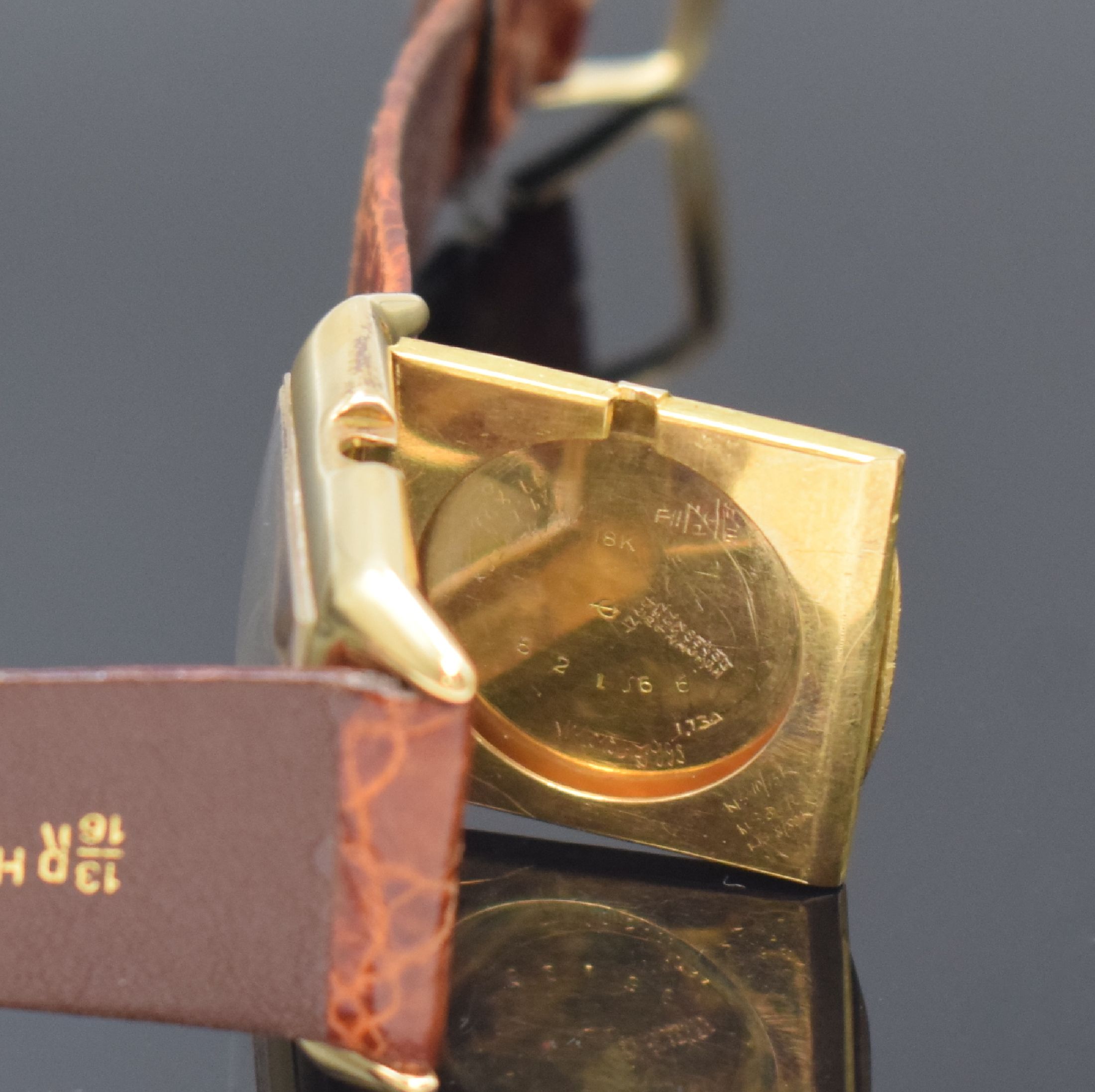 Detail d: IWC / Tiffany & Co. rechteckige Armbanduhr in 18k Gelbgold, Schweiz / USA um 1930, Handaufzug, amerikanisches Scharniergeh., silb. Zifferbl. rest., ...
