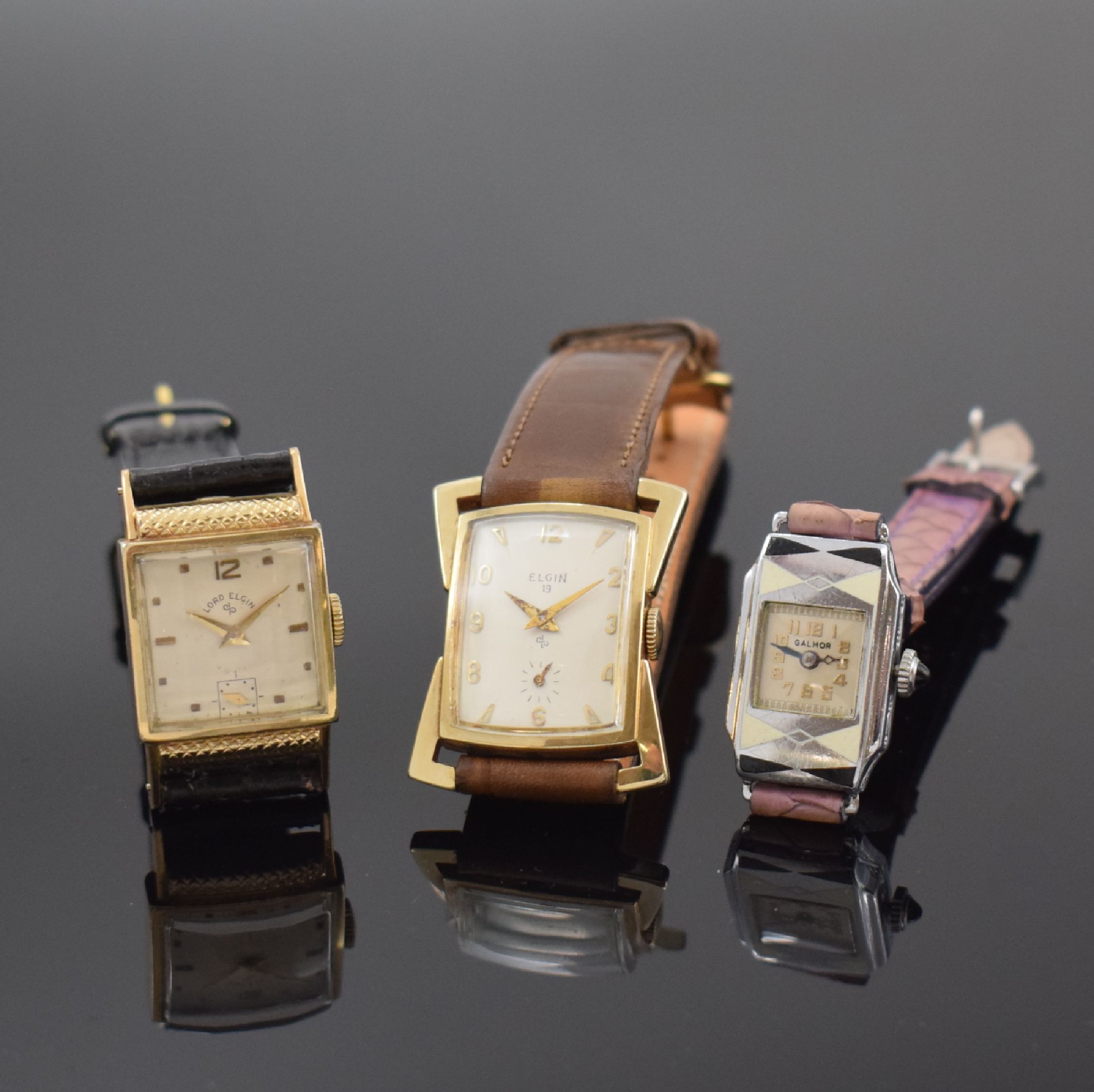ELGIN / GALMOR 3 Armbanduhren, USA um 1930 - 1950, Handaufzug, 1) LORD ELGIN, 2-tlg. 14k gold-filled Geh., Boden aufgedr., silb. Zifferbl. pat., ...
