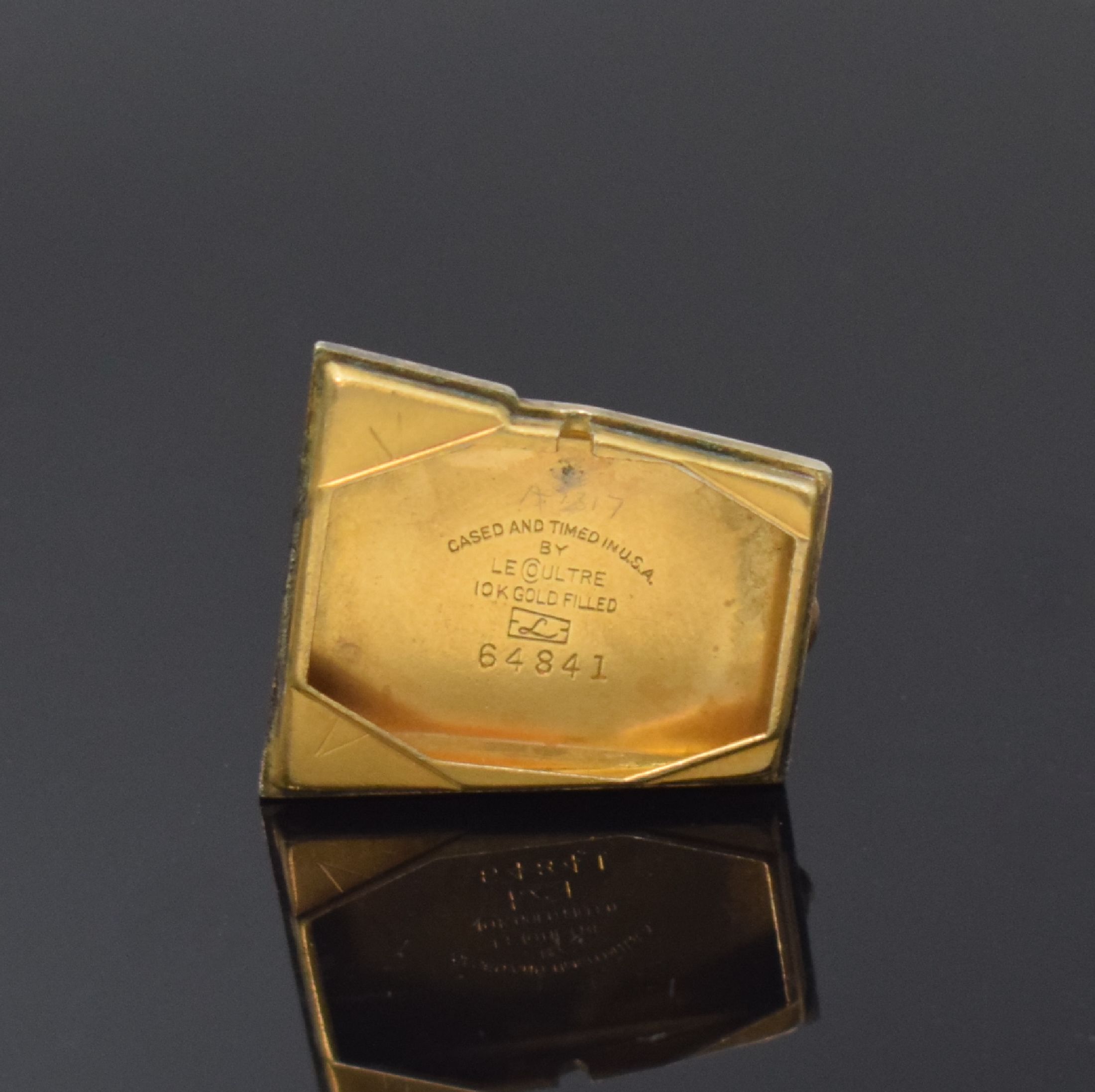 Detail e: Le COULTRE Grasshopper asymetrische Armbanduhr in 10k goldfilled, Schweiz USA um 1950, Handaufzug, 2-tlg. Trapez-förmiges Geh., Boden aufgedr., ...