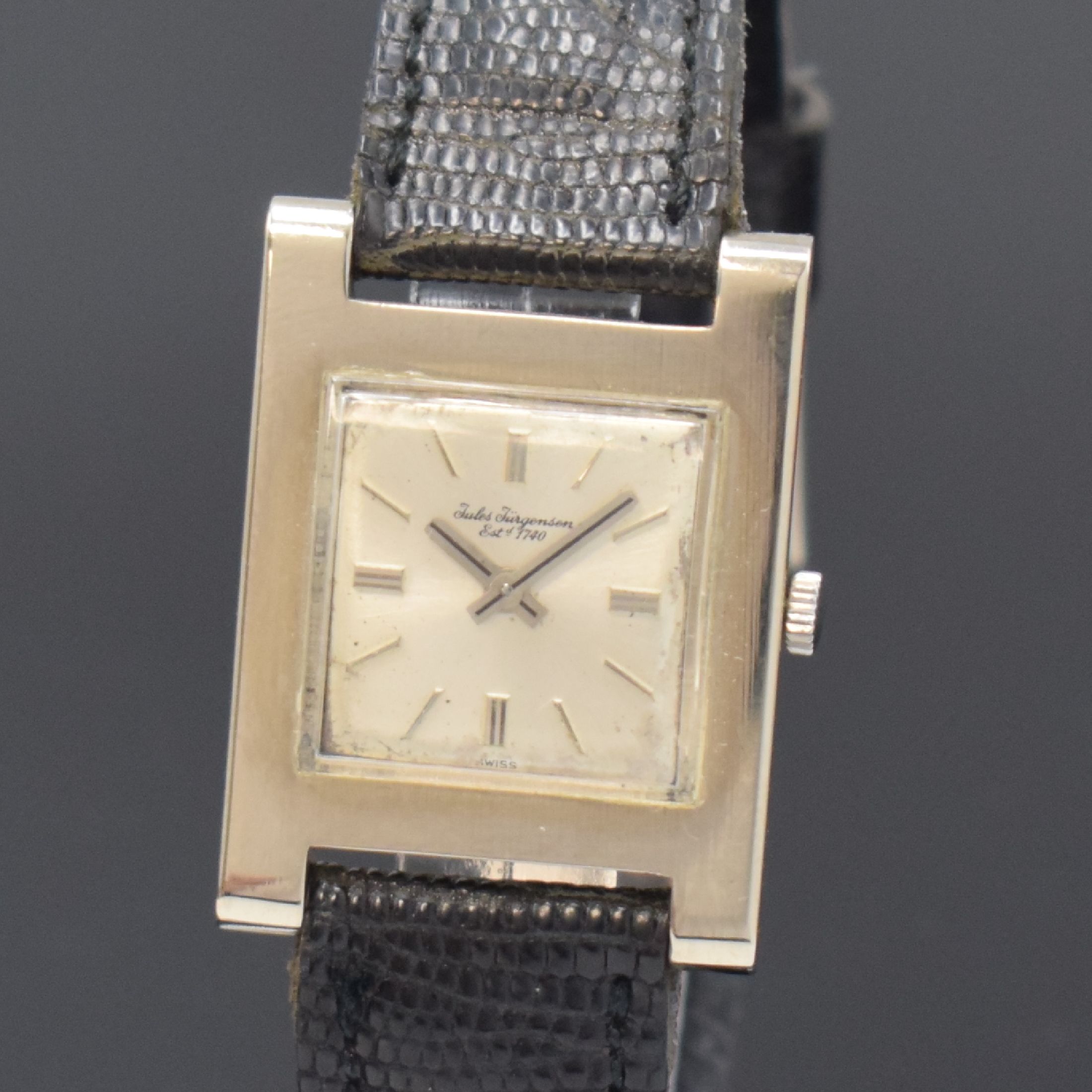 Detail a: JULES JÜRGENSEN elegante rechteckige Armbanduhr in WG 750/000, Schweiz um 1960, Handaufzug, 2-tlg. Geh., Boden aufgedr., silb. Zifferbl. fl., verg. ...