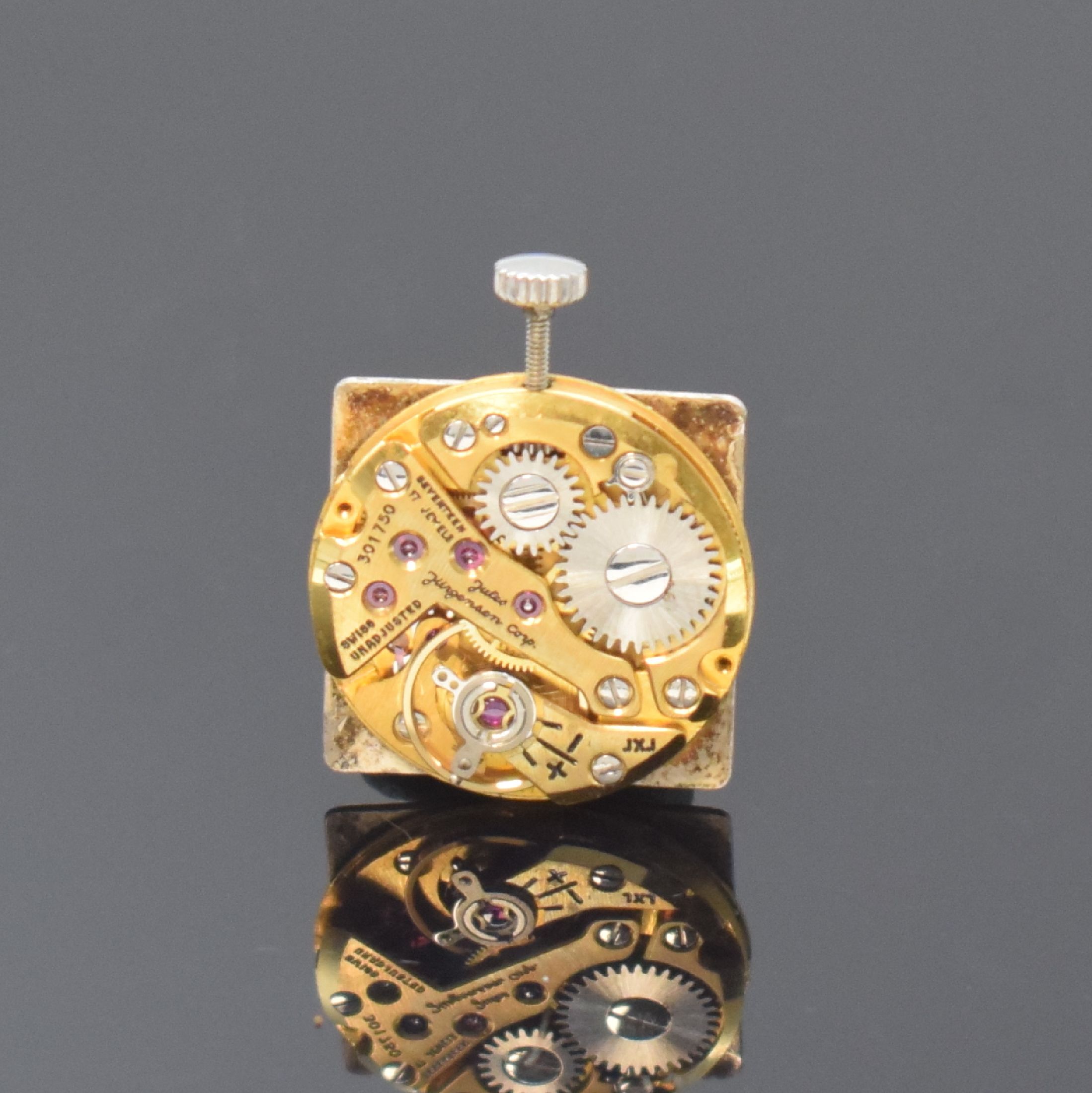 Detail d: JULES JÜRGENSEN elegante rechteckige Armbanduhr in WG 750/000, Schweiz um 1960, Handaufzug, 2-tlg. Geh., Boden aufgedr., silb. Zifferbl. fl., verg. ...