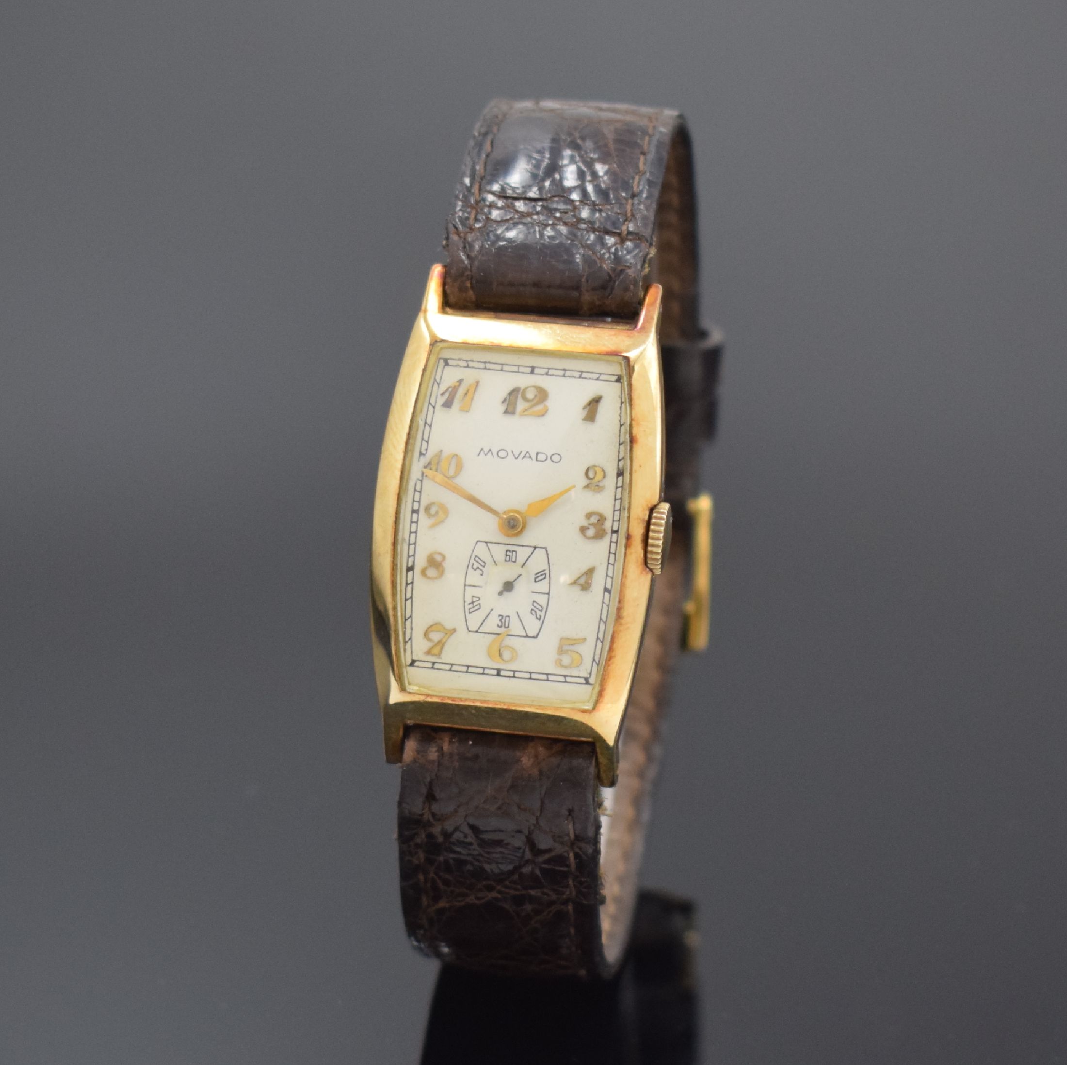 MOVADO Referenz 41310 Armbanduhr in GG 585/000, Schweiz um 1930, Handaufzug, tonneauförm. Scharniergeh., creme-farb. Zifferbl. rest., aufges. gold. ...