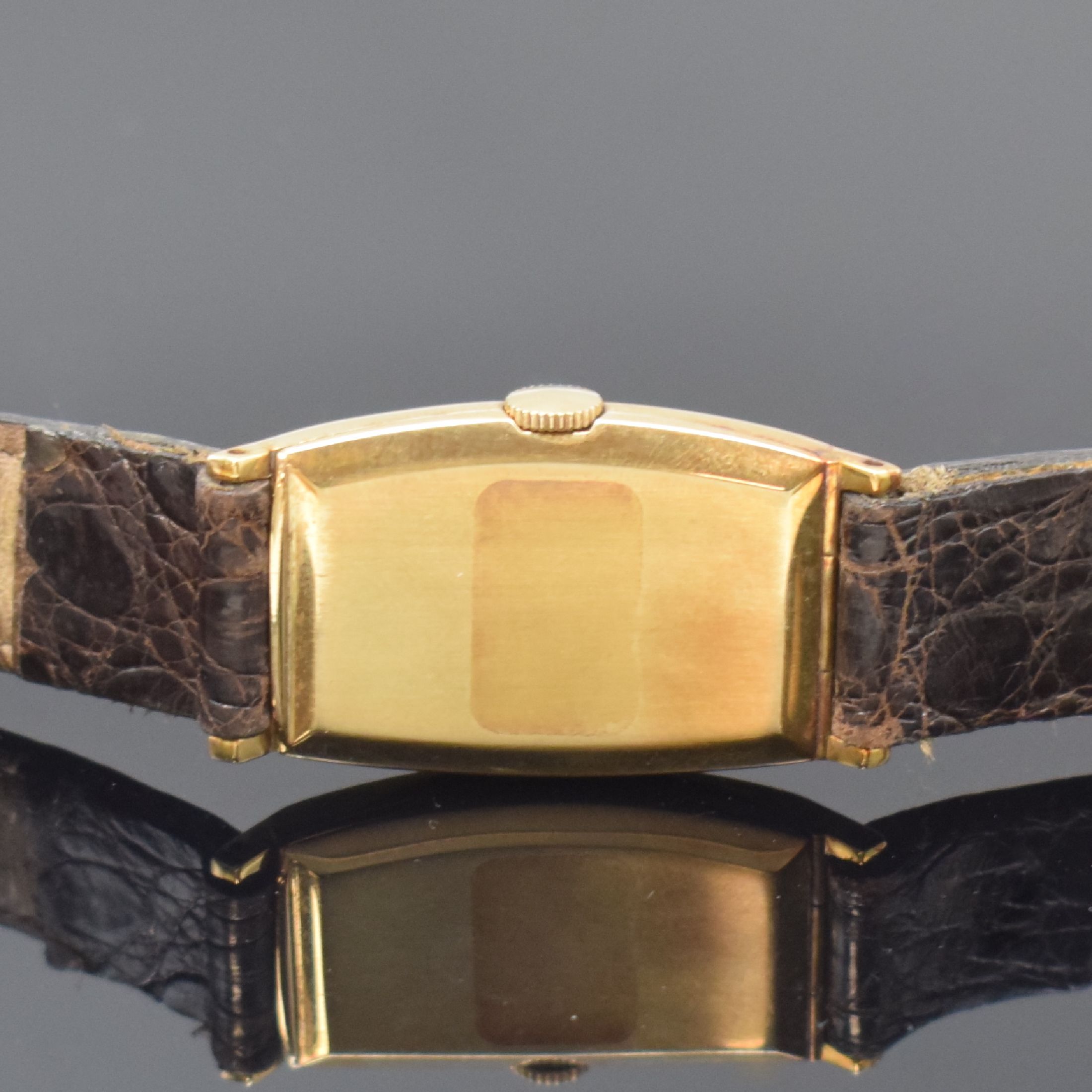 Detail b: MOVADO Referenz 41310 Armbanduhr in GG 585/000, Schweiz um 1930, Handaufzug, tonneauförm. Scharniergeh., creme-farb. Zifferbl. rest., aufges. gold. ...