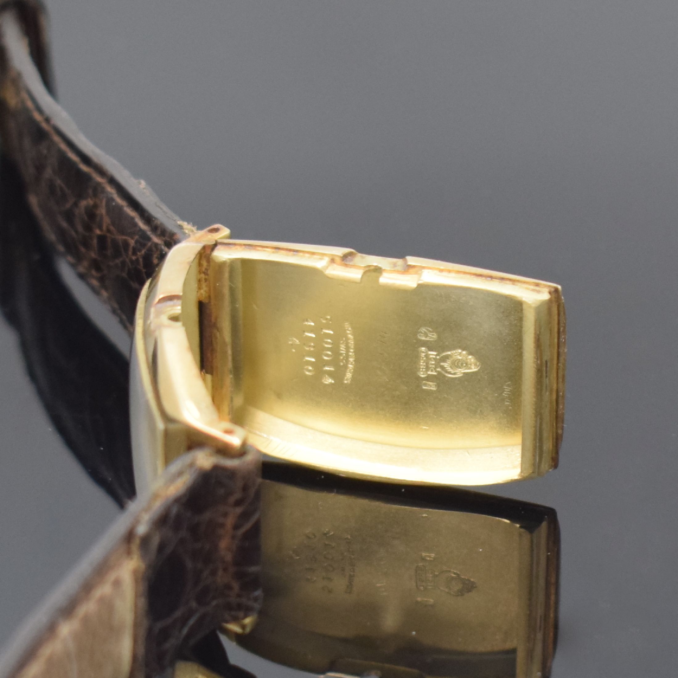 Detail c: MOVADO Referenz 41310 Armbanduhr in GG 585/000, Schweiz um 1930, Handaufzug, tonneauförm. Scharniergeh., creme-farb. Zifferbl. rest., aufges. gold. ...