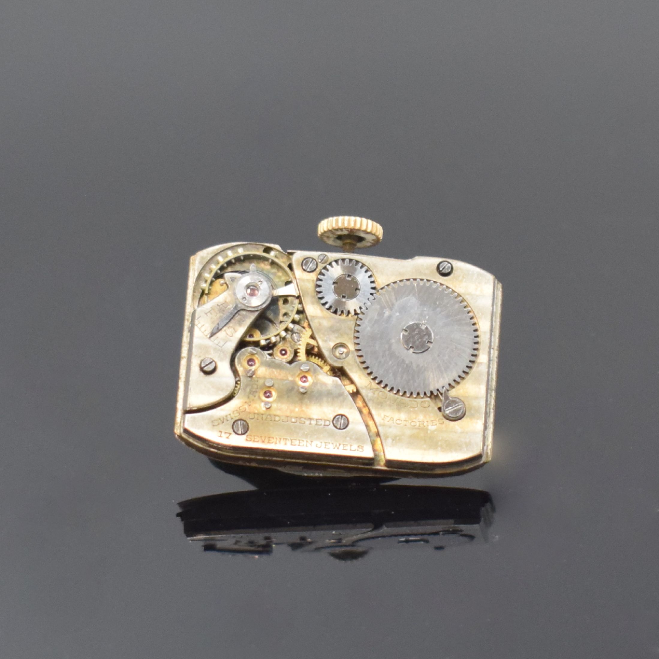 Detail d: MOVADO Referenz 41310 Armbanduhr in GG 585/000, Schweiz um 1930, Handaufzug, tonneauförm. Scharniergeh., creme-farb. Zifferbl. rest., aufges. gold. ...