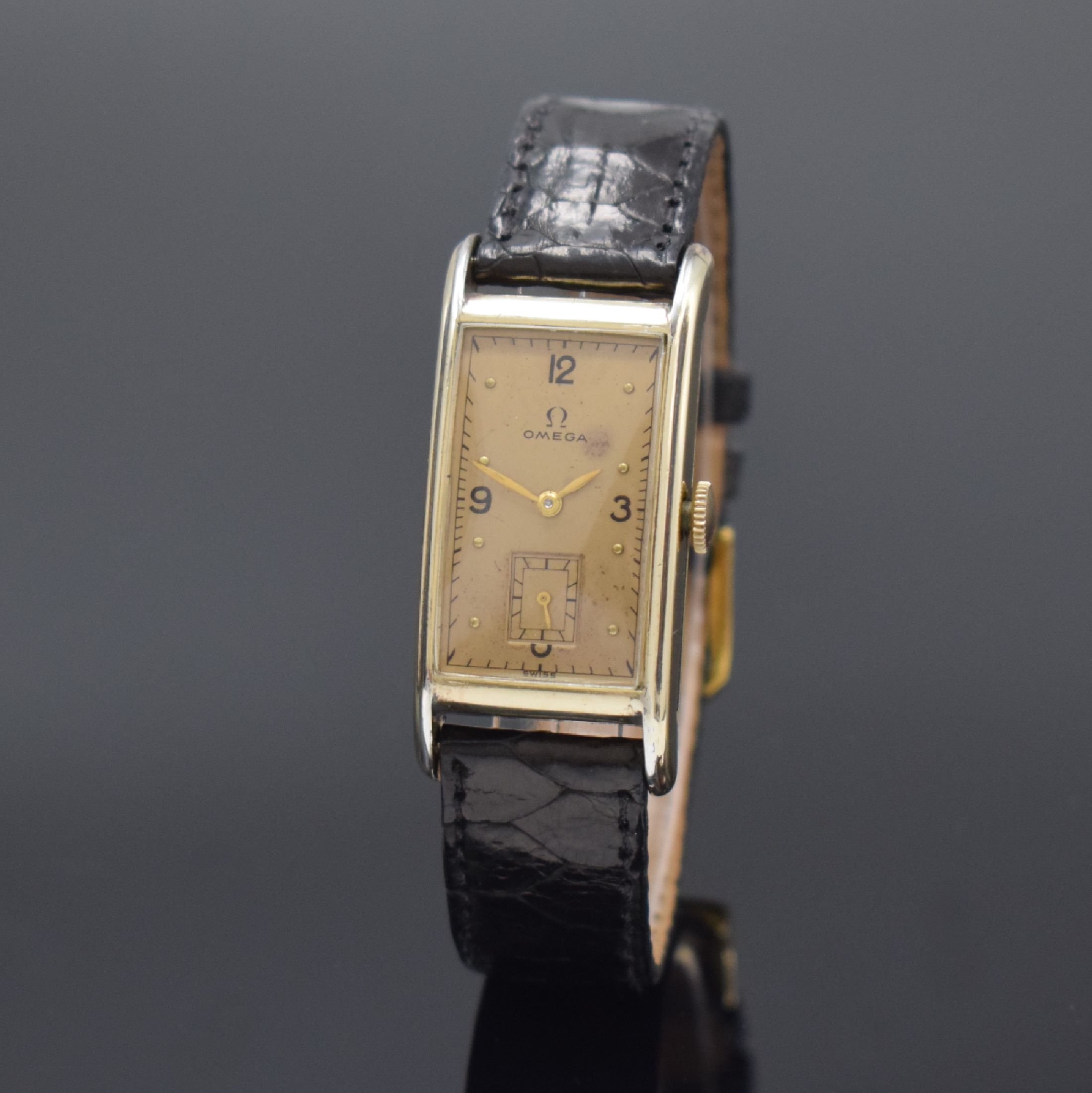 OMEGA T 17 rechteckige Armbanduhr in 14k goldfilled, Schweiz / USA um 1940, Handaufzug, 2-tlg. Geh., Boden aufgedr., gold. Zifferbl. pat./fl., gold. ...