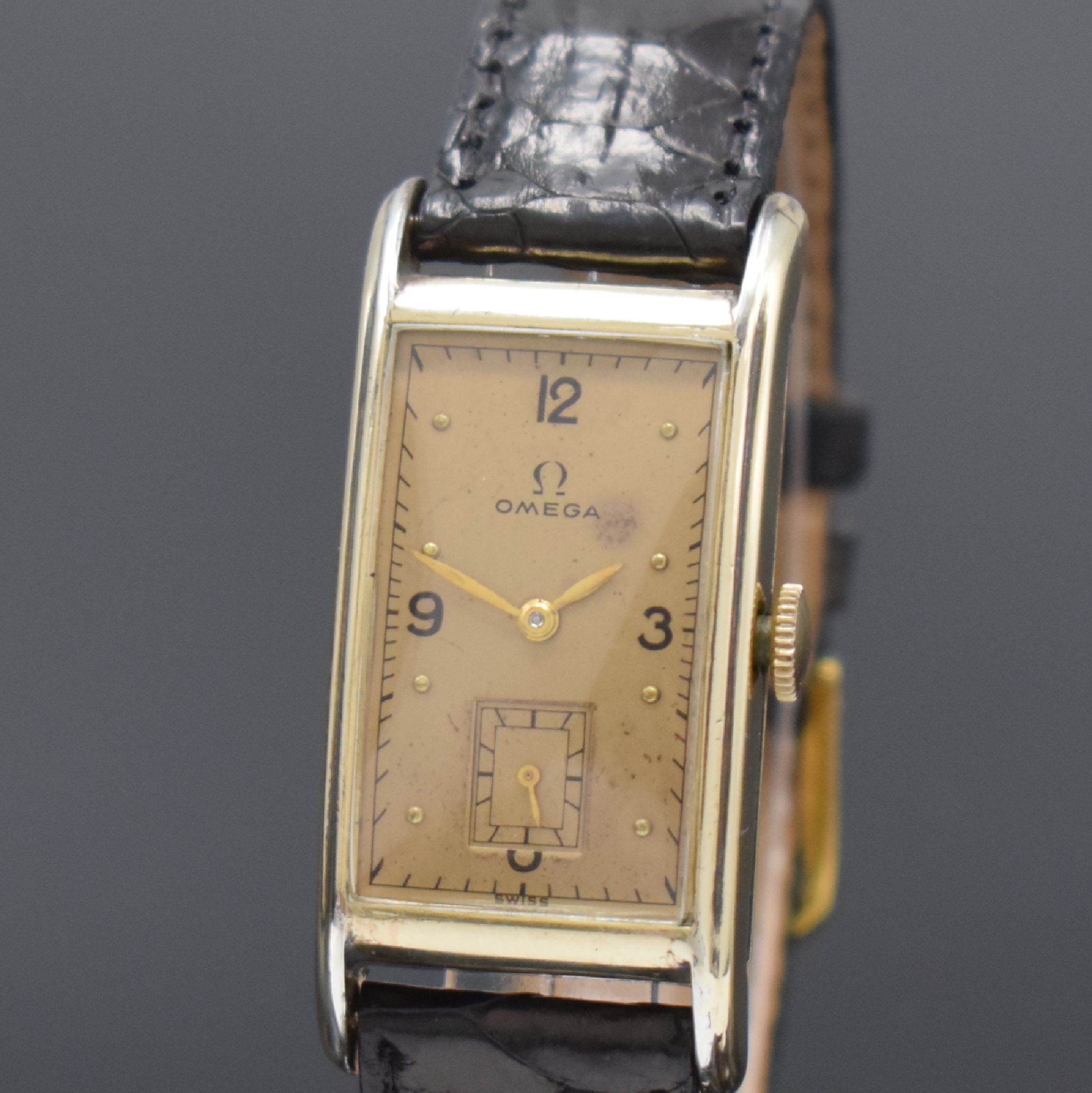 Detail a: OMEGA T 17 rechteckige Armbanduhr in 14k goldfilled, Schweiz / USA um 1940, Handaufzug, 2-tlg. Geh., Boden aufgedr., gold. Zifferbl. pat./fl., gold. ...