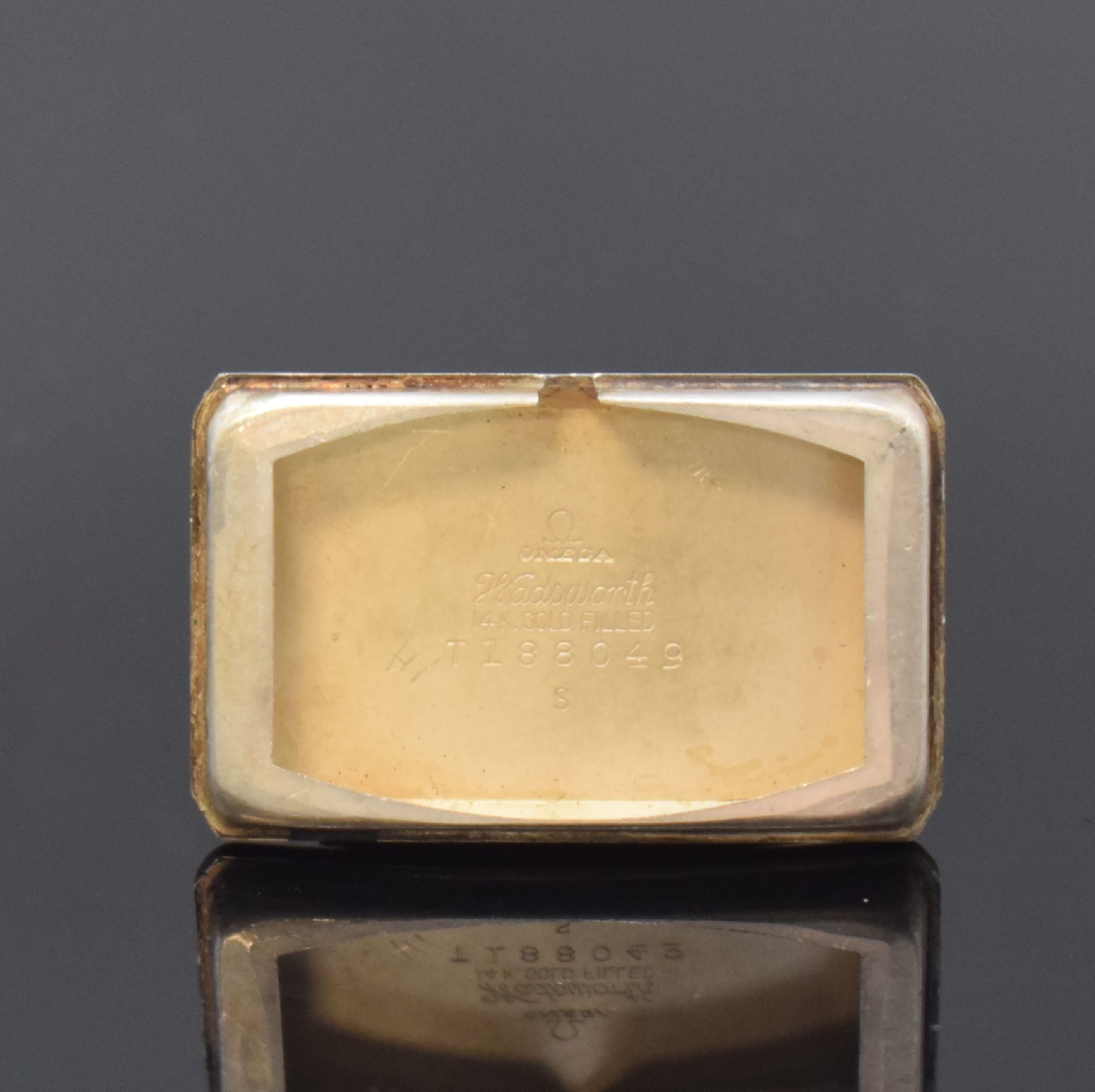 Detail d: OMEGA T 17 rechteckige Armbanduhr in 14k goldfilled, Schweiz / USA um 1940, Handaufzug, 2-tlg. Geh., Boden aufgedr., gold. Zifferbl. pat./fl., gold. ...