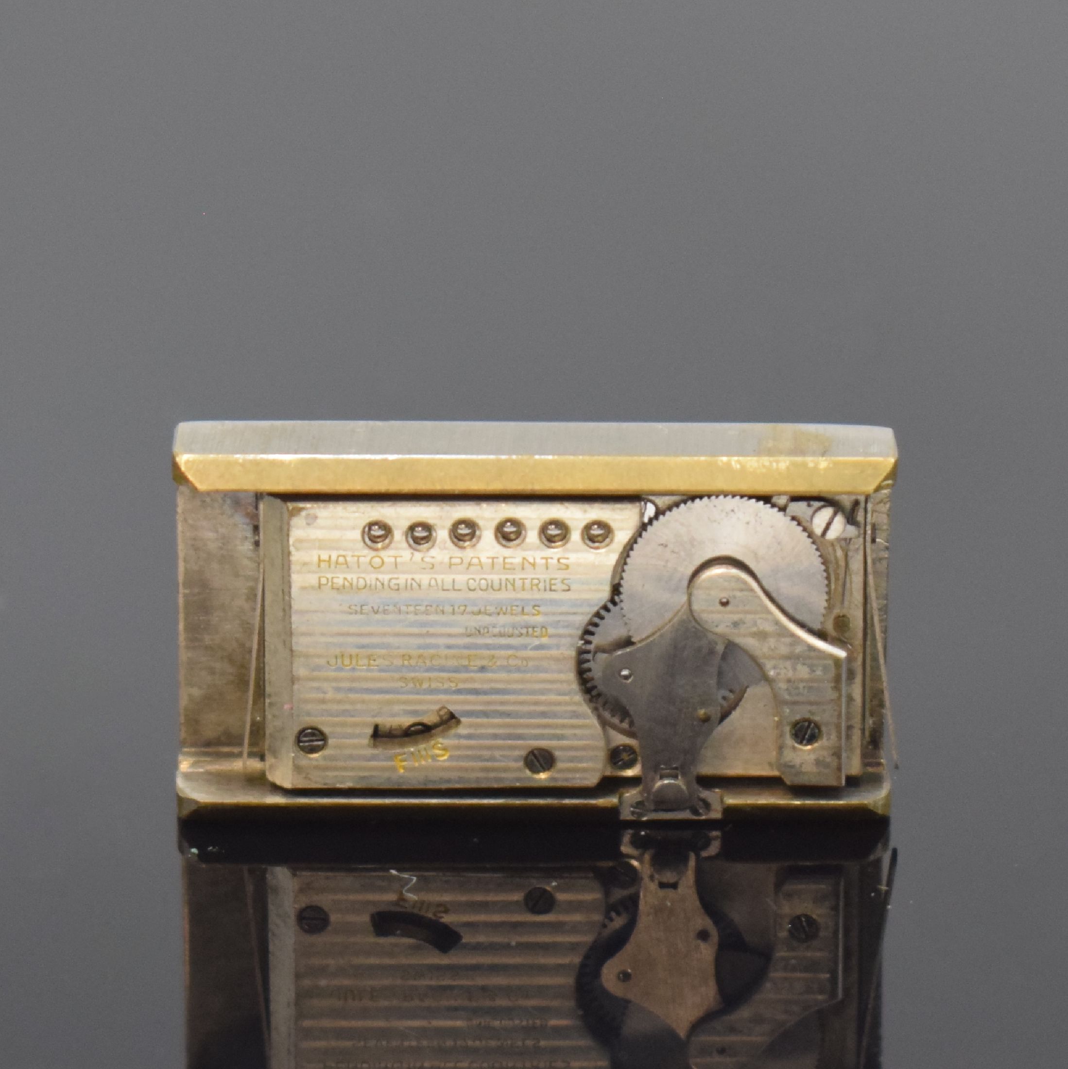 Detail d: ATO ROLLS / JULES RACINE frühe Automatik- Armbanduhr, Schweiz um 1930, rechteckiges Scharniergeh., verchromt, darin Rüttelkammer für das ...
