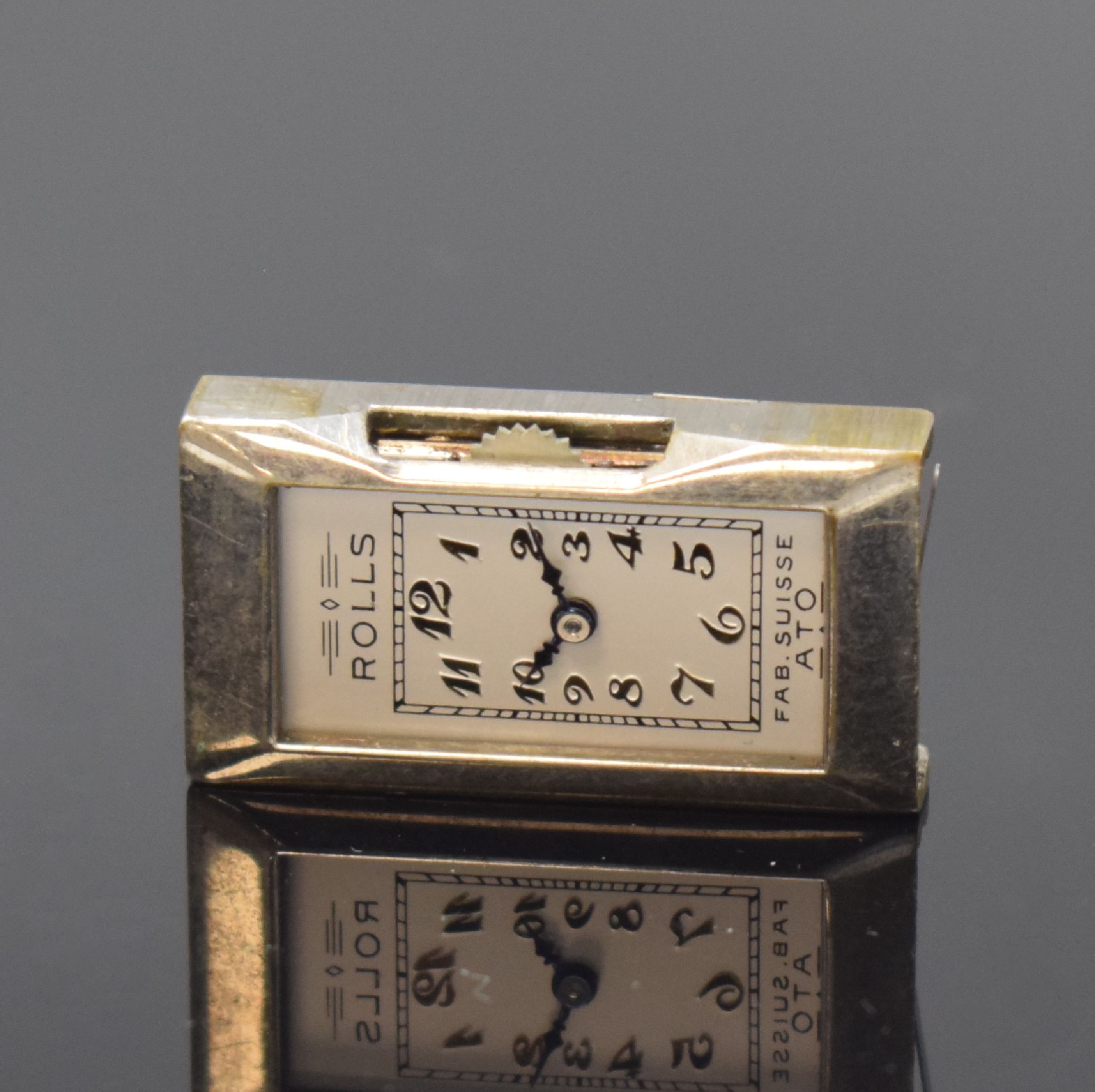 Detail e: ATO ROLLS / JULES RACINE frühe Automatik- Armbanduhr, Schweiz um 1930, rechteckiges Scharniergeh., verchromt, darin Rüttelkammer für das ...