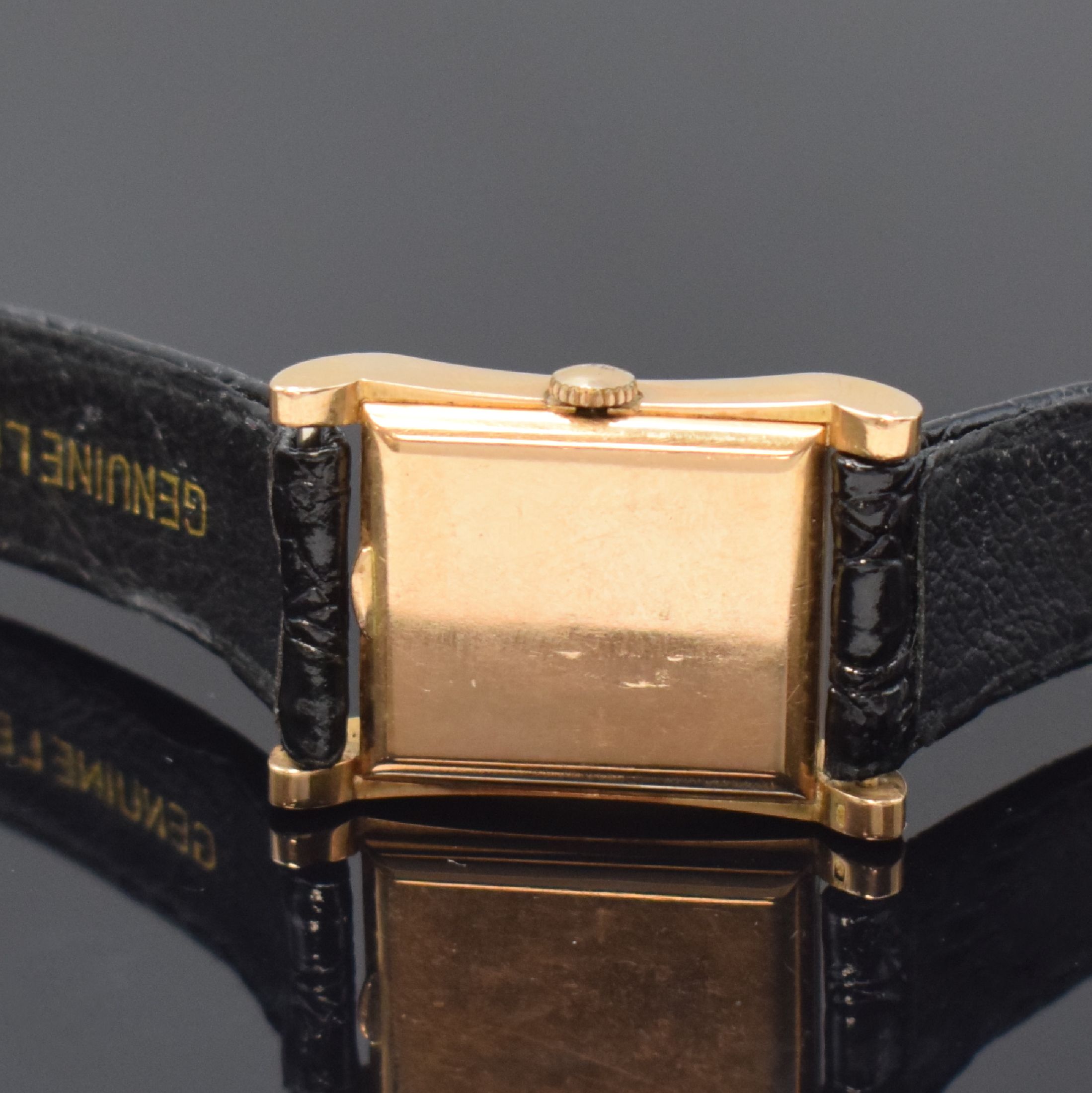 Detail c: TISSOT rechteckige Armbanduhr in RG 750/000, Schweiz um 1950, Handaufzug, 2-tlg. Geh. m. geschweiften Seiten, Boden aufgedr., silb. Zifferbl. ...