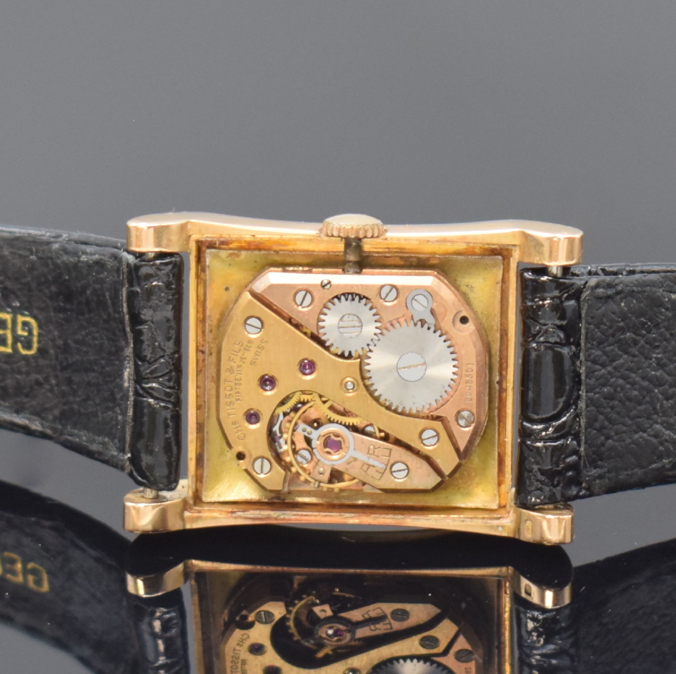 Detail d: TISSOT rechteckige Armbanduhr in RG 750/000, Schweiz um 1950, Handaufzug, 2-tlg. Geh. m. geschweiften Seiten, Boden aufgedr., silb. Zifferbl. ...