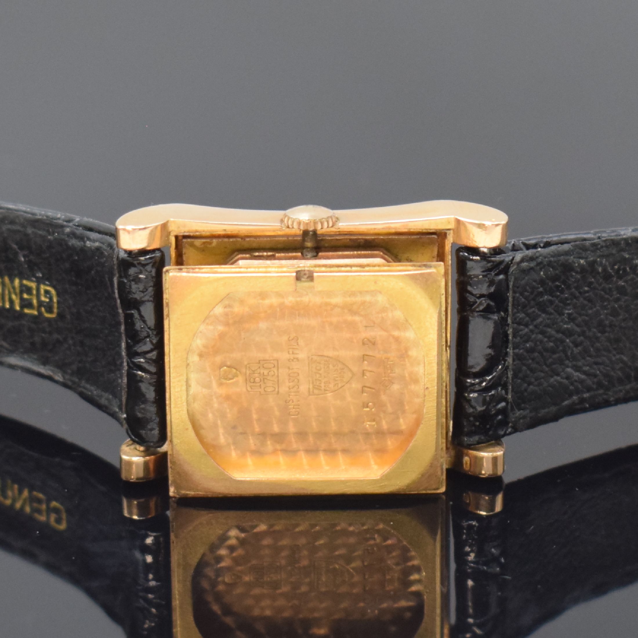 Detail e: TISSOT rechteckige Armbanduhr in RG 750/000, Schweiz um 1950, Handaufzug, 2-tlg. Geh. m. geschweiften Seiten, Boden aufgedr., silb. Zifferbl. ...