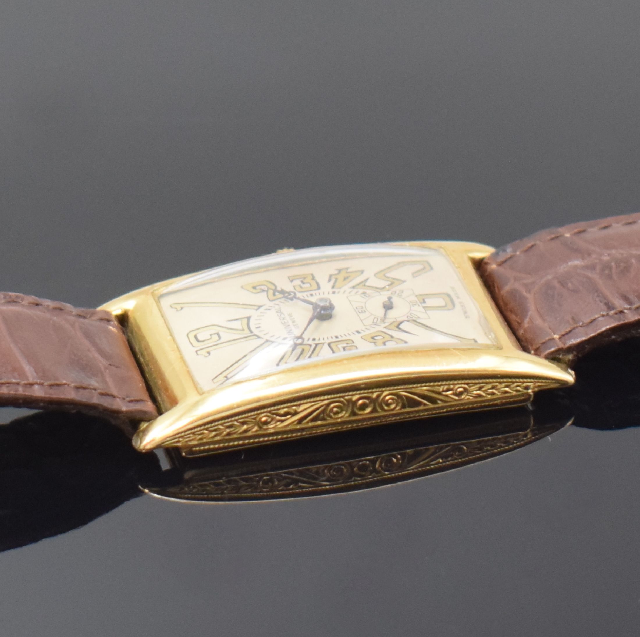 Detail c: UNIVERSAL GENEVE große rechteckige Armbanduhr in GG 750/000, Schweiz um 1930, Handaufzug, Scharniergeh. m. grav. Rand, silb. Zifferbl. rest., Zeiger ...